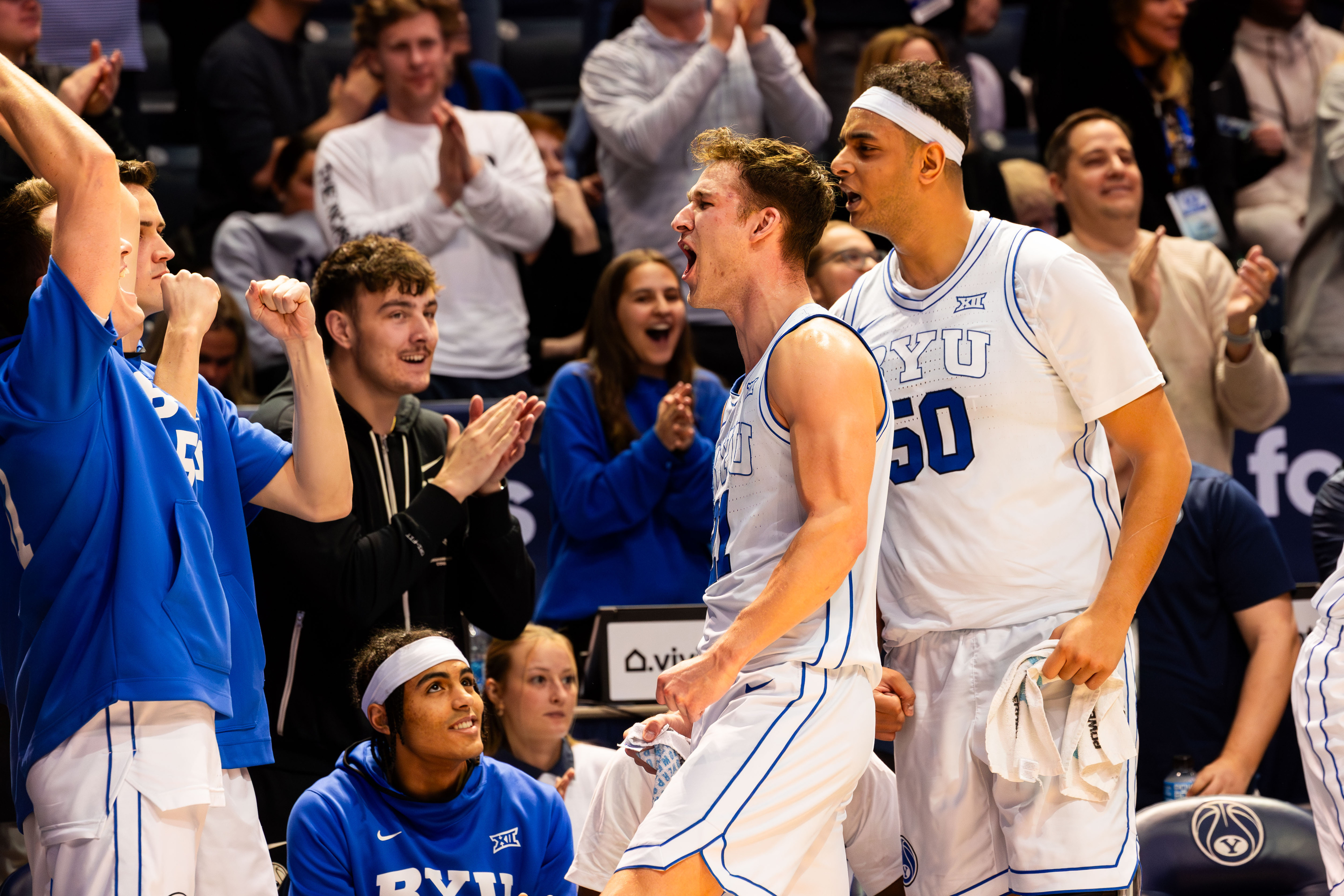 Brigham Young players celebrate from the bench after their victory 78-71 over Baylor University in a men’s college basketball game at the Marriott Center in Provo on Tuesday, Feb. 20, 2024.