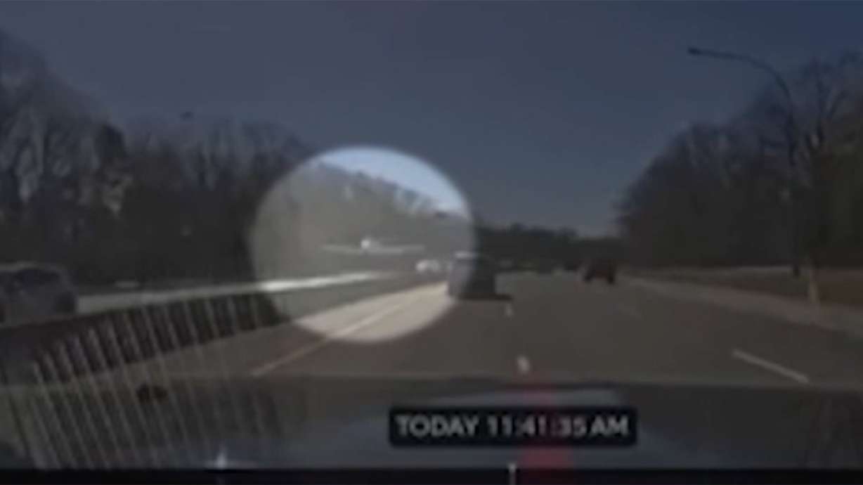 Dash camera captures the moment a small plane comes in for an emergency landing on the side of the Southern State Parkway in Long Island, N.Y.