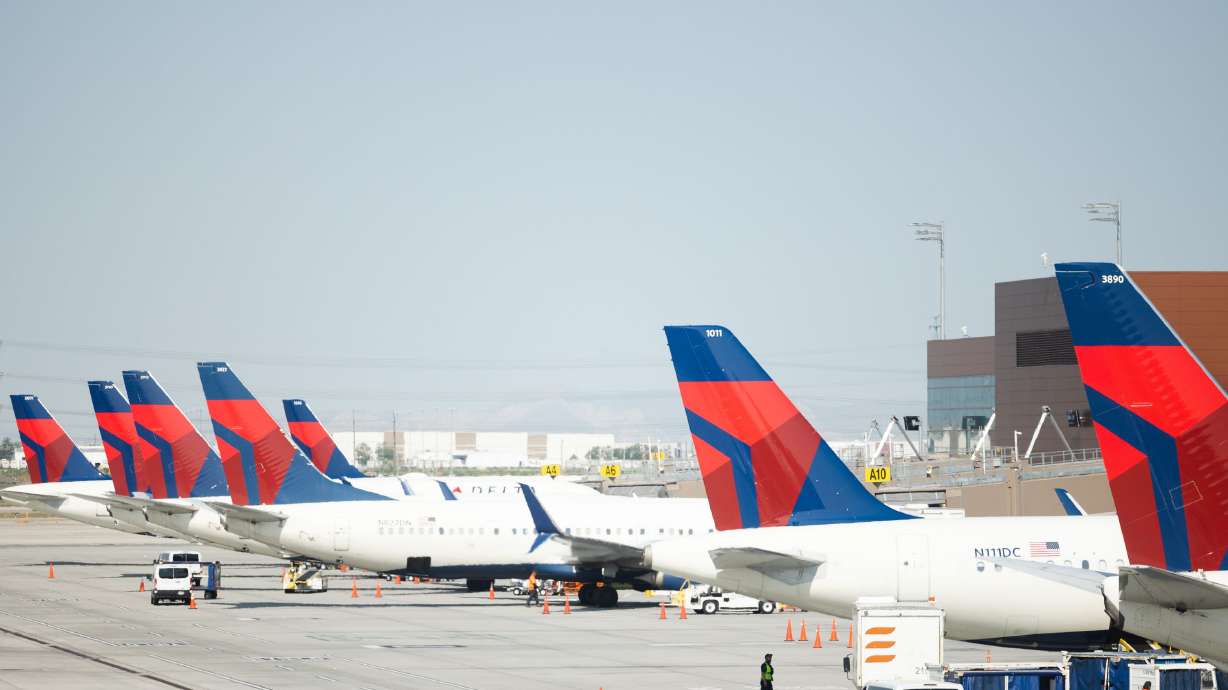 Delta Air Lines planes wait on the tarmac at the Salt Lake City International Airport in Salt Lake City on May 19, 2023. The airline will offer a flight to be airborne during the April 8 solar eclipse.