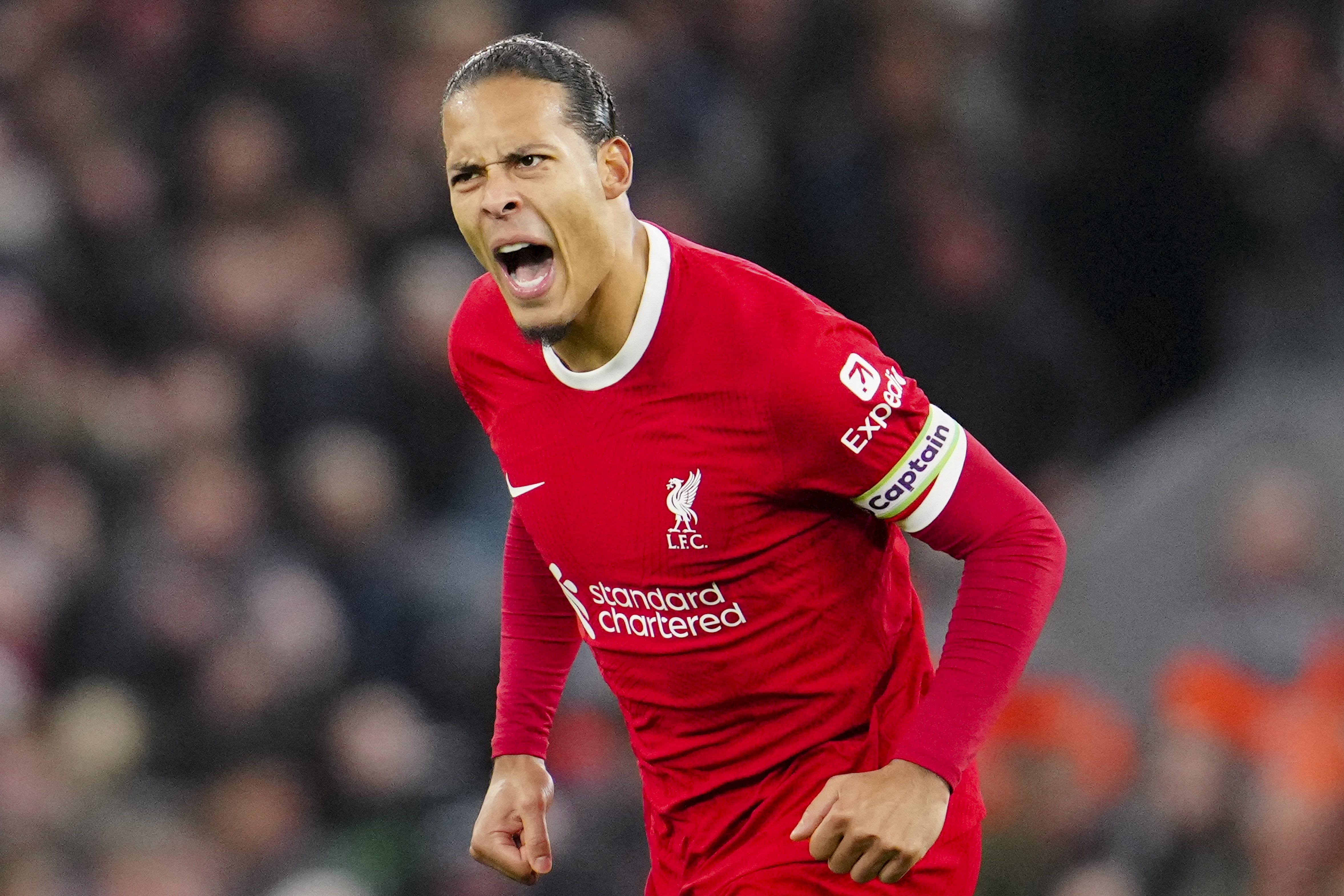 Liverpool's Virgil van Dijk celebrates after scoring his side's first goal during the English Premier League soccer match between Liverpool and Luton Town, at Anfield stadium in Liverpool, England, Wednesday, Feb. 21, 2024.
