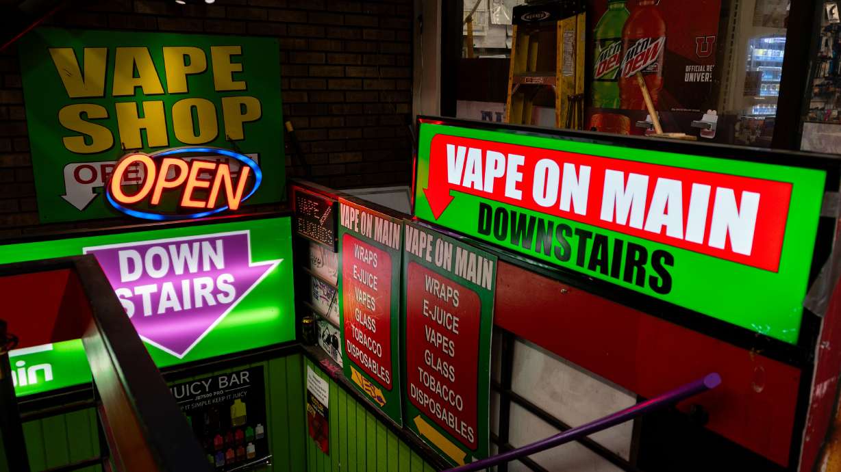 Signs for Vape on Main in Salt Lake City on Wednesday. A new bill would ban most flavored vapes in Utah.