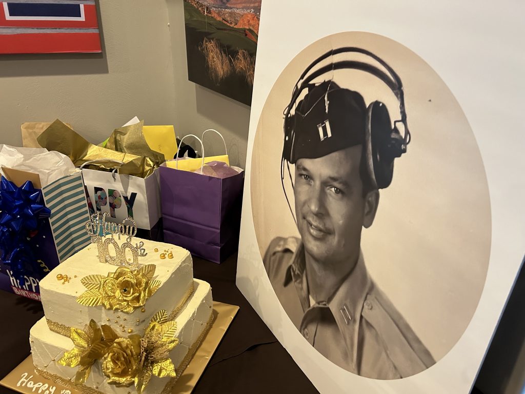 A portrait of Wally Humphrey checks out his 100th birthday presents in St. George on Saturday. Humphreys, a St. George resident since 1993, is an American World War II hero who made it to his 100th birthday.