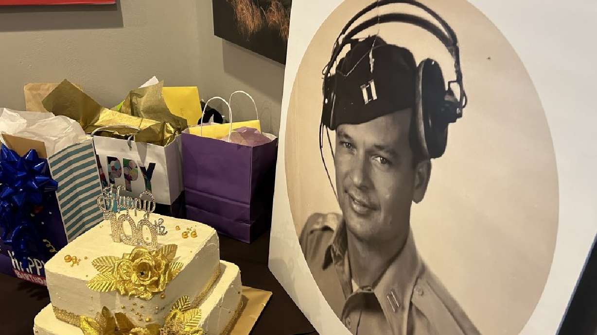 A portrait of Wally Humphrey checks out his 100th birthday presents in St. George on Saturday. Humphreys, a St. George resident since 1993, is an American World War II hero who made it to his 100th birthday.