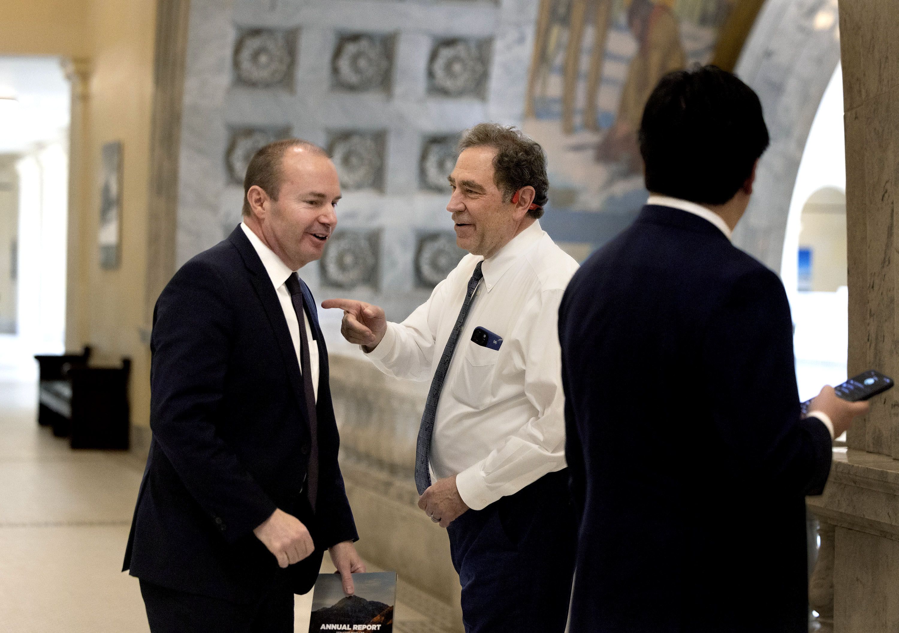 U.S. Sen. Mike Lee, R-Utah, speaks to Rep. Brian King, D-Salt Lake City, at the Capitol in Salt Lake City on Wednesday.