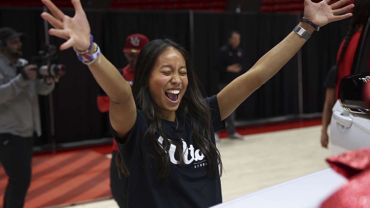 Gymnast Alani Sabado celebrates a vehicle lease deal as part of a name, image and likeness package in Salt Lake City on Dec. 13, 2023. A committee advanced Utah's attempt to regulate college athletes' use of their name, image and likeness.