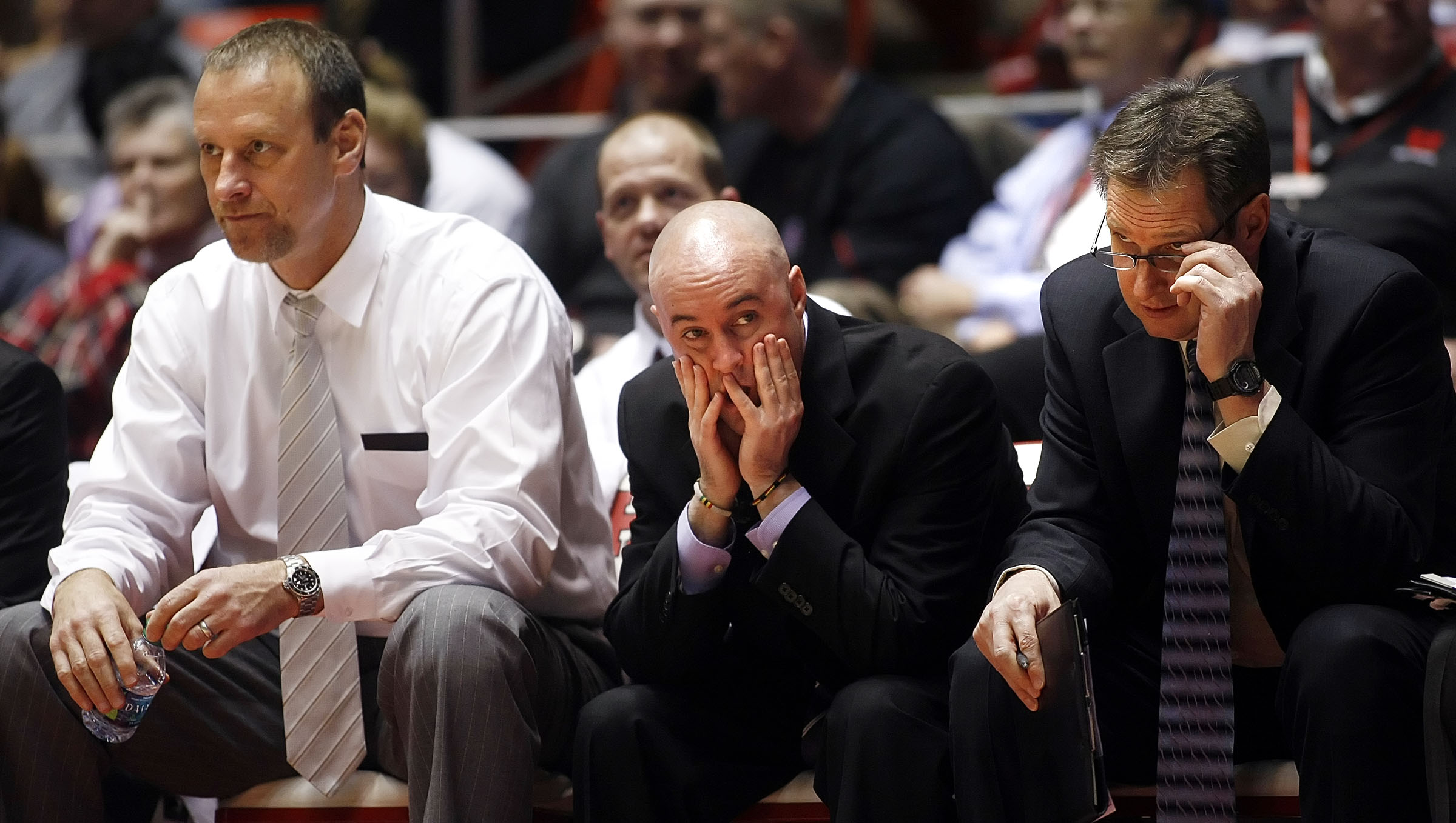 Utah's Head Coach Larry Krystkowiak, left, Assistant Coach Andy Hill, center, and Director of Operations Norm Parrish watch as Utah and the Cal Bears play Thursday, Feb. 23, 2012 in the Huntsman Center.