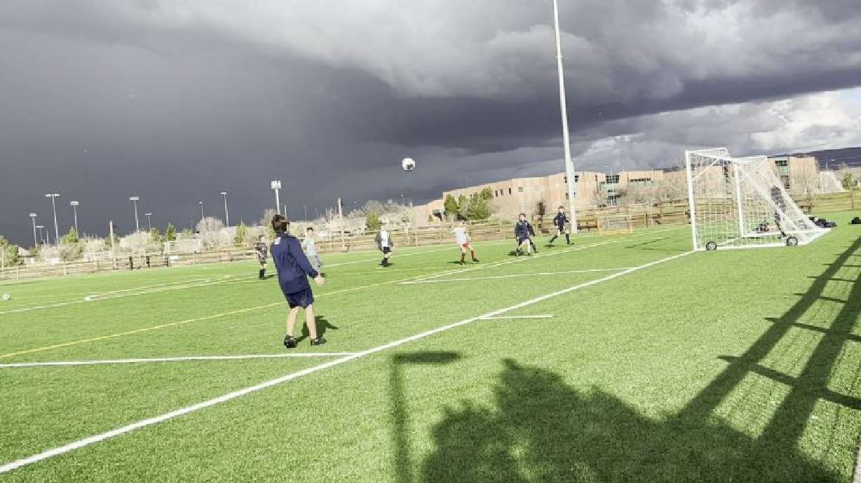 Soccer players practicing their sport at the Little Valley soccer fields, St. George, Utah, Thursday. Artificial turf recently installed is a part of area water conservation efforts.