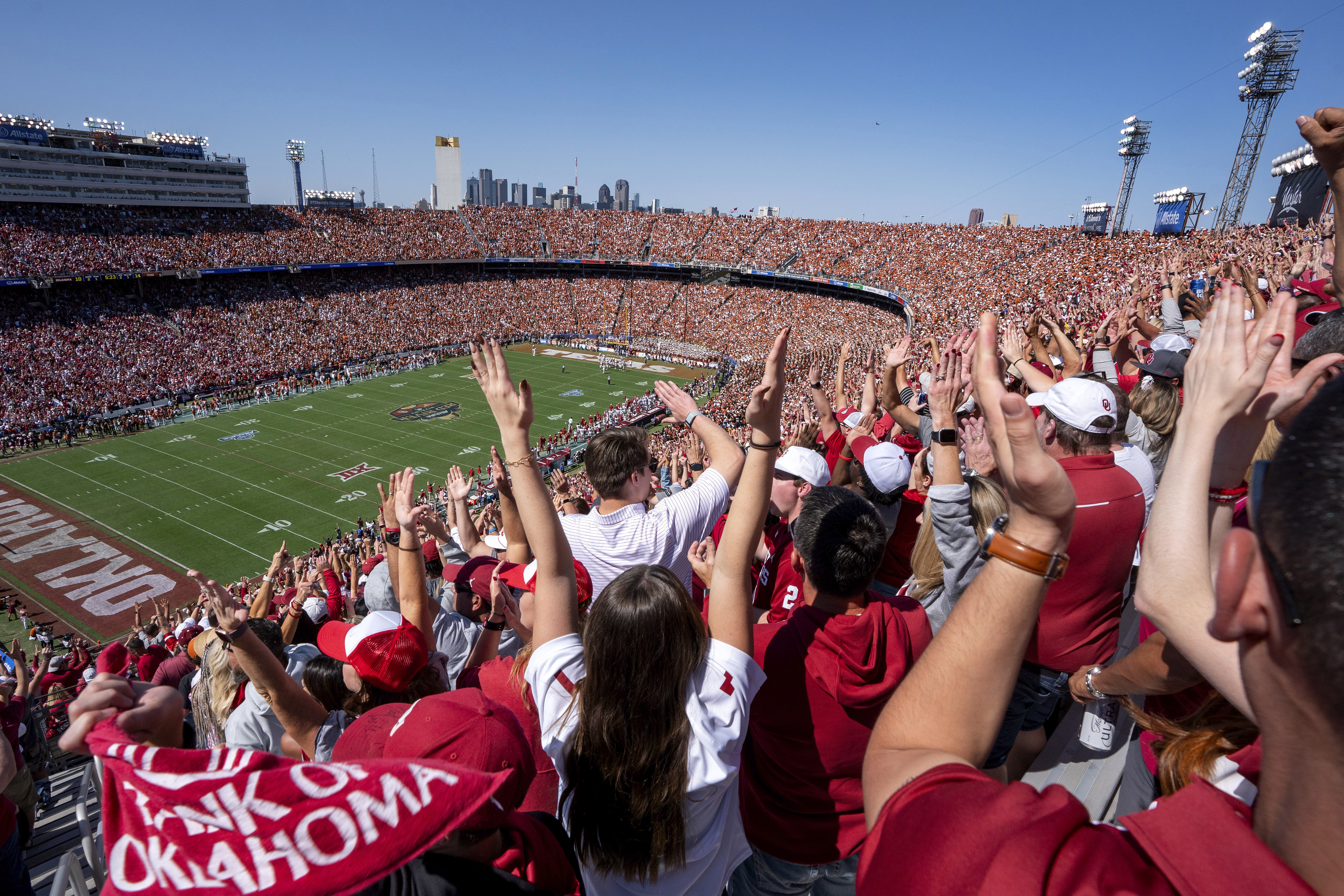Oklahoma fans celebrate a touchdown during the first half of an NCAA college football game against Texas at the Cotton Bowl, Saturday, Oct. 7, 2023, in Dallas. The ESPN “College GameDay” analyst Kirk Herbstreit and the network's broadcaster Chris Fowler announced Thursday, Feb. 22, 2024, on social media they will be voices in EA Sports' upcoming college football video game. 