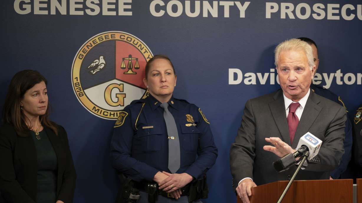 Genesee County Prosecutor David Leyton, Michigan State Police Lt. Kim Vetter and Sen. Kristen McDonald Rivet hold a press conference Tuesday announcing charges after a 2-year-old girl accidentally shot herself.