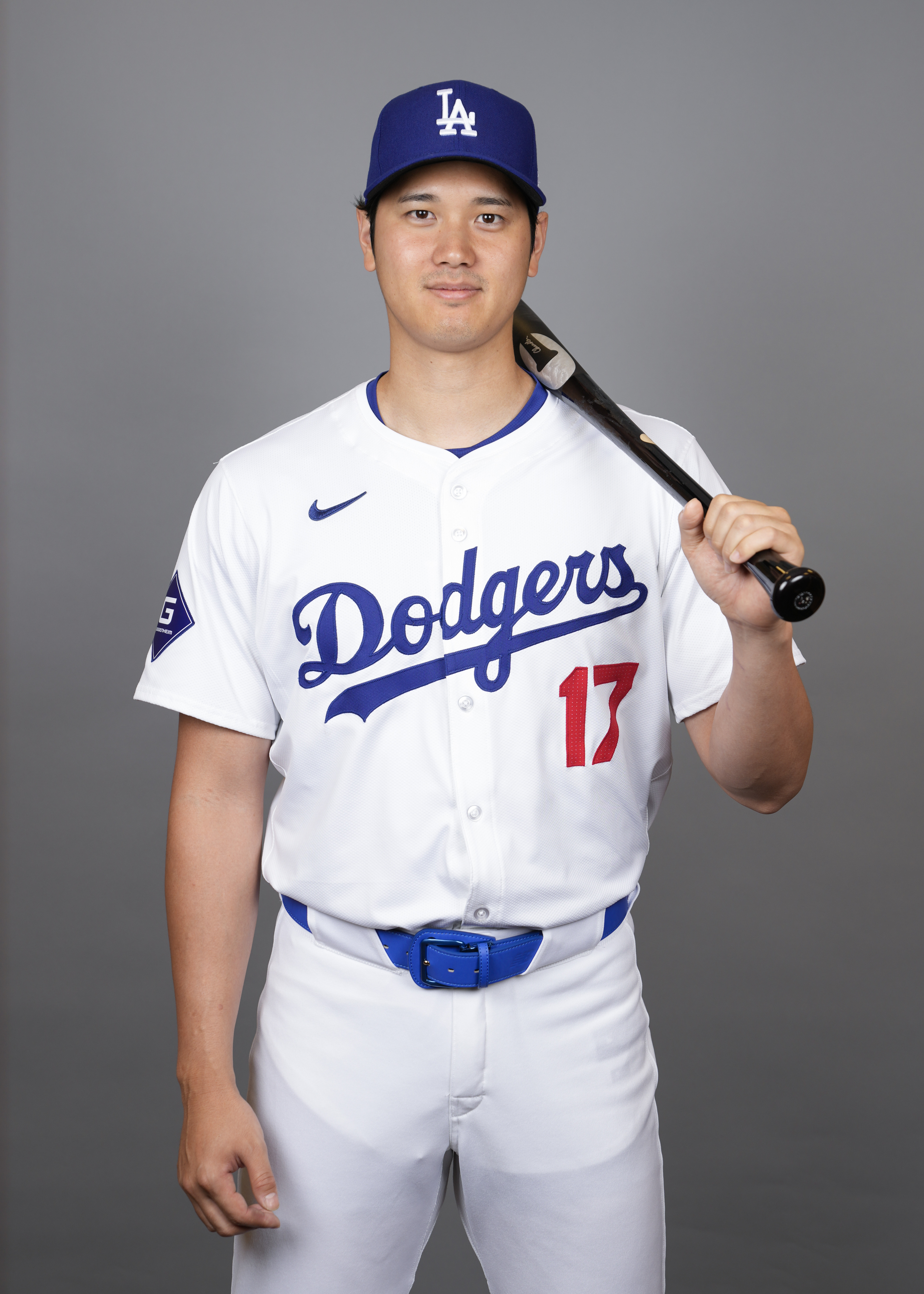 Los Angeles Dodgers designated hitter Shohei Ohtani poses for a photo during a spring training baseball photo day on Wednesday, Feb. 21, 2024, in Phoenix. 