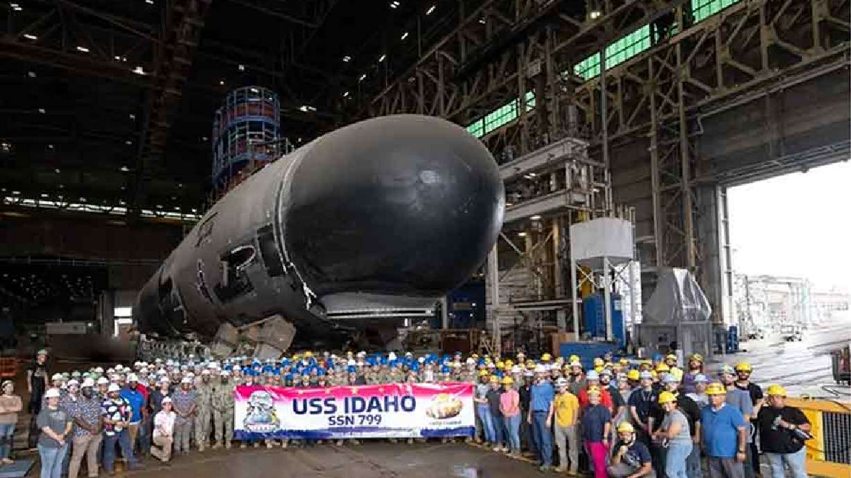 The USS Idaho crew and Electric Boat employees in front of the future USS Idaho SSN 799 in October 2023. The naval submarine bearing Idaho's name will be christened and launched into the Atlantic Ocean next month.