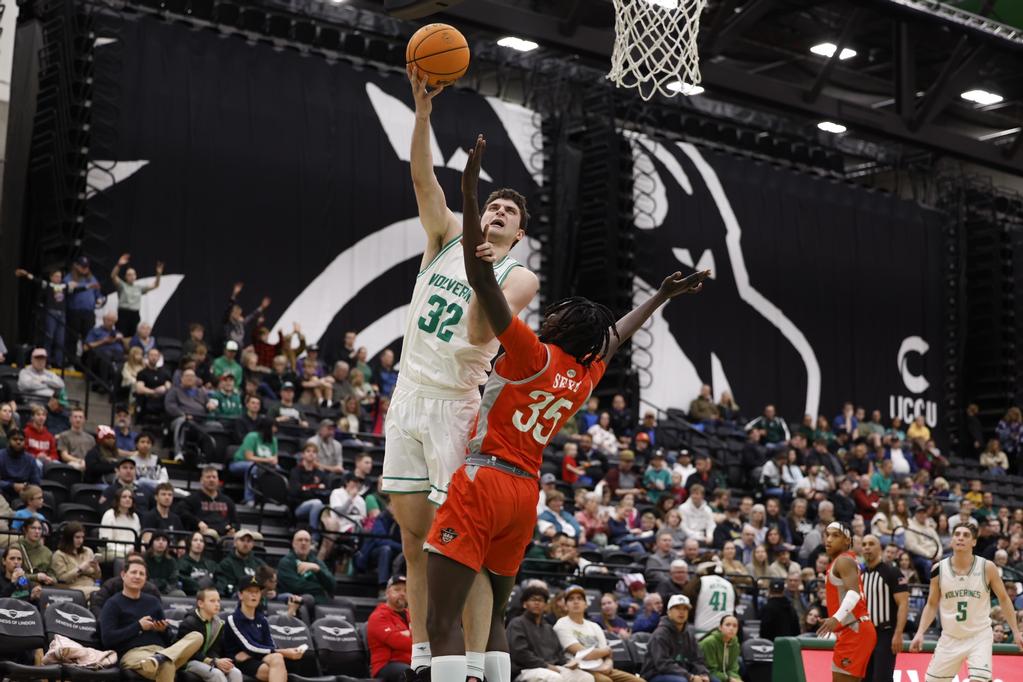 Utah Valley's Trevin Dorius (32) shoots over UTRGV's Saliou Saye (35) Thursday night at UCCU Center.