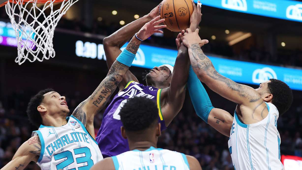 Utah Jazz forward Taylor Hendricks (0) shoots over Charlotte Hornets guard Tre Mann (23) in Salt Lake City on Thursday, Feb. 22, 2024. The Hornets won 115-107.