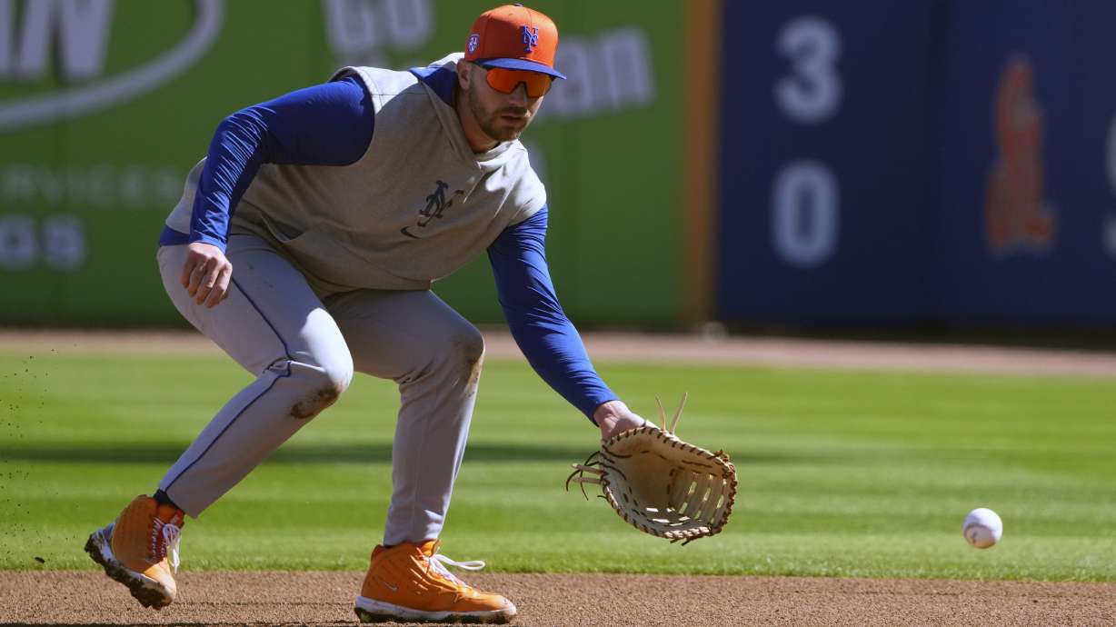 New York Mets' Pete Alonso handles a grounder during a spring training baseball workout Tuesday, Feb. 20, 2024, in Port St. Lucie, Fla.