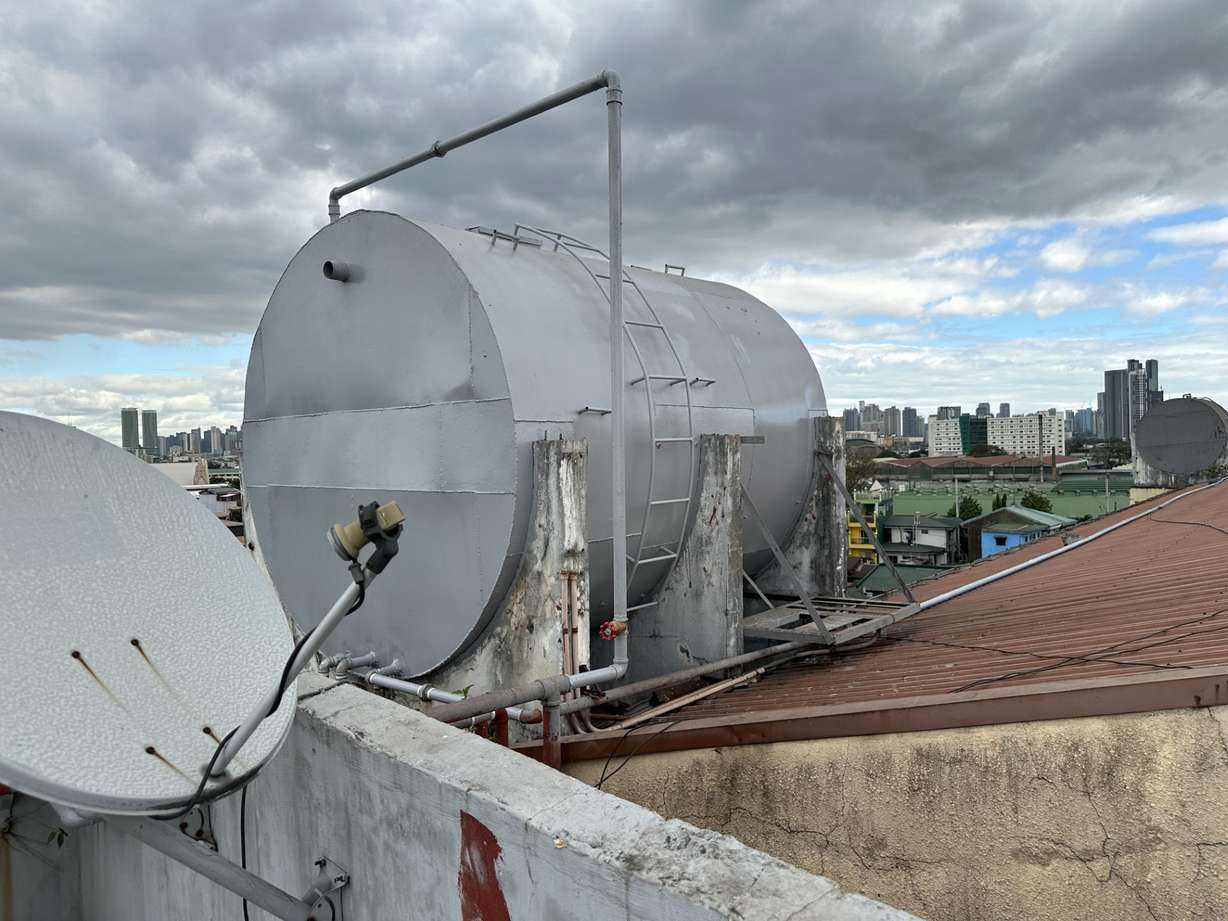 One of the new water tanks installed atop an apartment building in the Philippines. The complex previously had no access to fresh water.