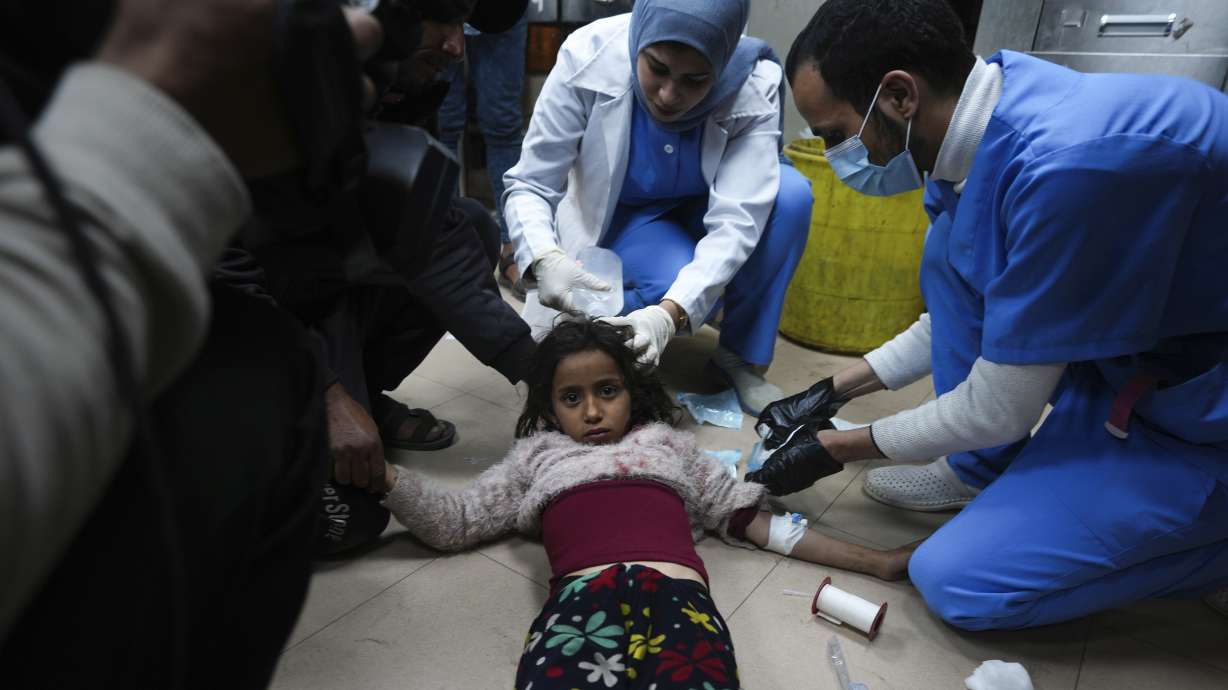 Palestinians wounded in the Israeli bombardment of the Gaza Strip are brought to Al Aqsa hospital in Deir al Balah, Friday.