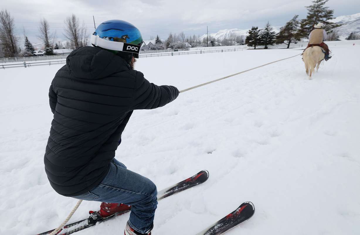 Trevor Howard, on horseback, and skier Scott Hoover practice for an upcoming skijoring competition in Heber City on Feb. 6.