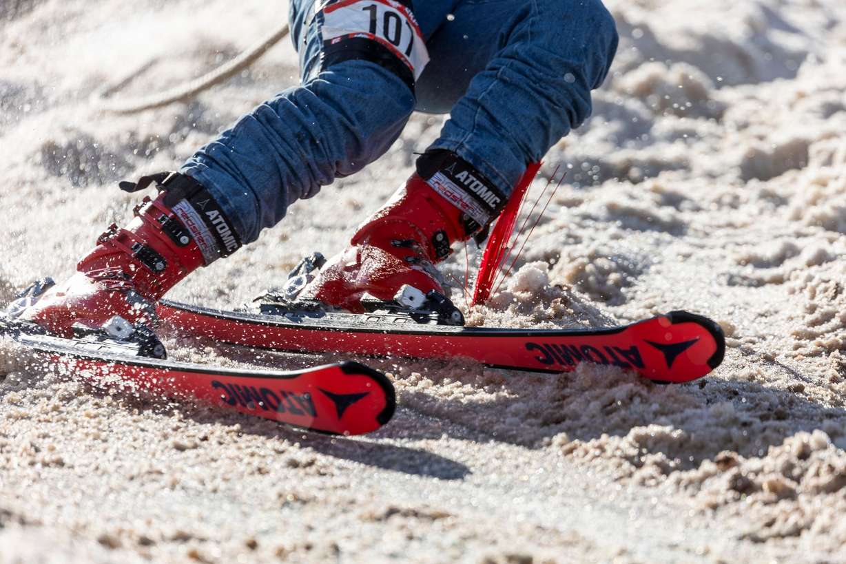 A skier rounds a turn past a gate during the 2024 Utah Skijoring competition compete in skijoring at the Wasatch County Event Complex in Heber City on Feb. 17. Skiers are expected to clear gates on the course or be penalized three seconds on their time.
