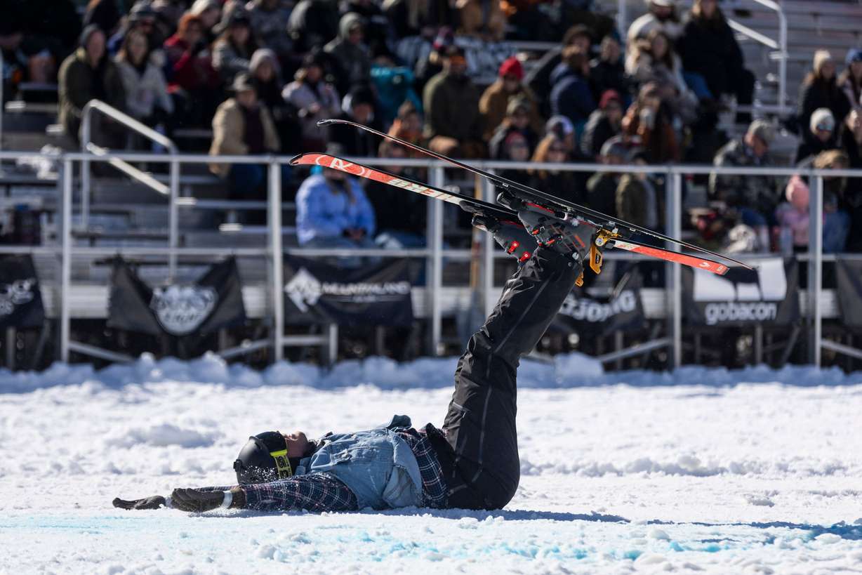 Tommy Flitton lays on his back after crashing over a jump during the 2024 Utah Skijoring competition at the Wasatch County Event Complex in Heber City on Feb. 17.