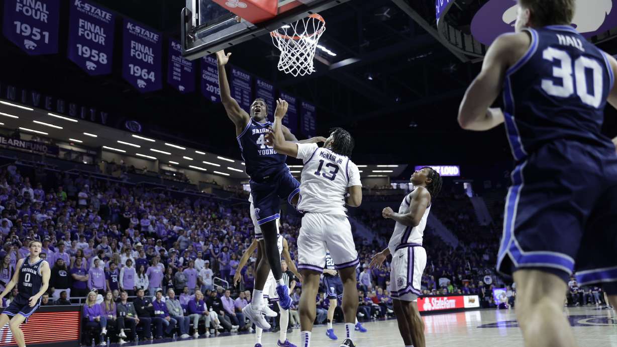 BYU forward Fousseyni Traore lays in a shot against Kansas State during a Big 12 men's basketball game, Saturday, Feb. 24, 2024 in Manhattan, Kansas.