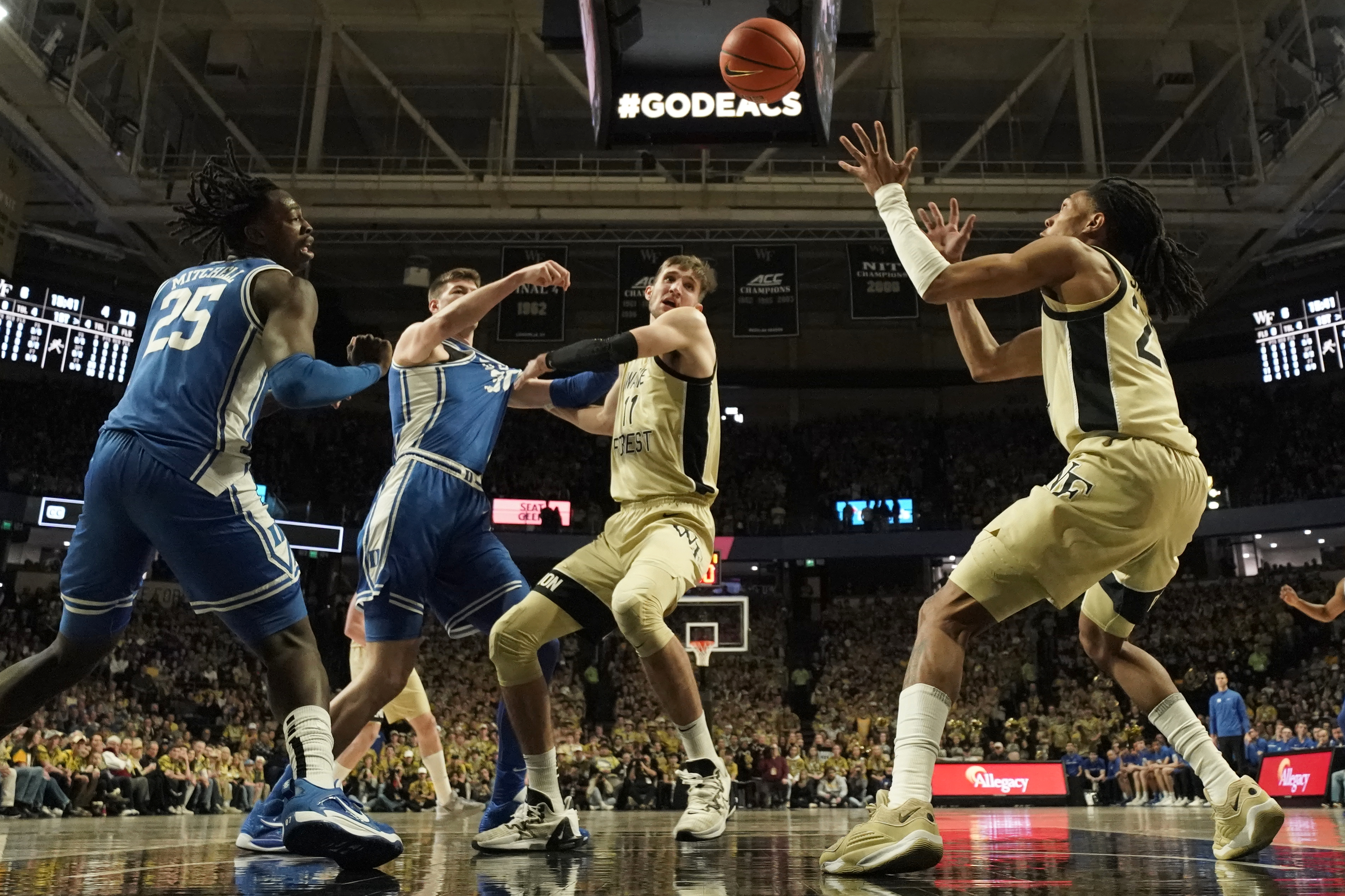 Duke's Kyle Filipowski (30) loses the ball as Wake Forest's Andrew Carr (11) and Hunter Sallis (23) defend during the first half of an NCAA college basketball game in Winston-Salem, N.C., Saturday, Feb. 24, 2024.