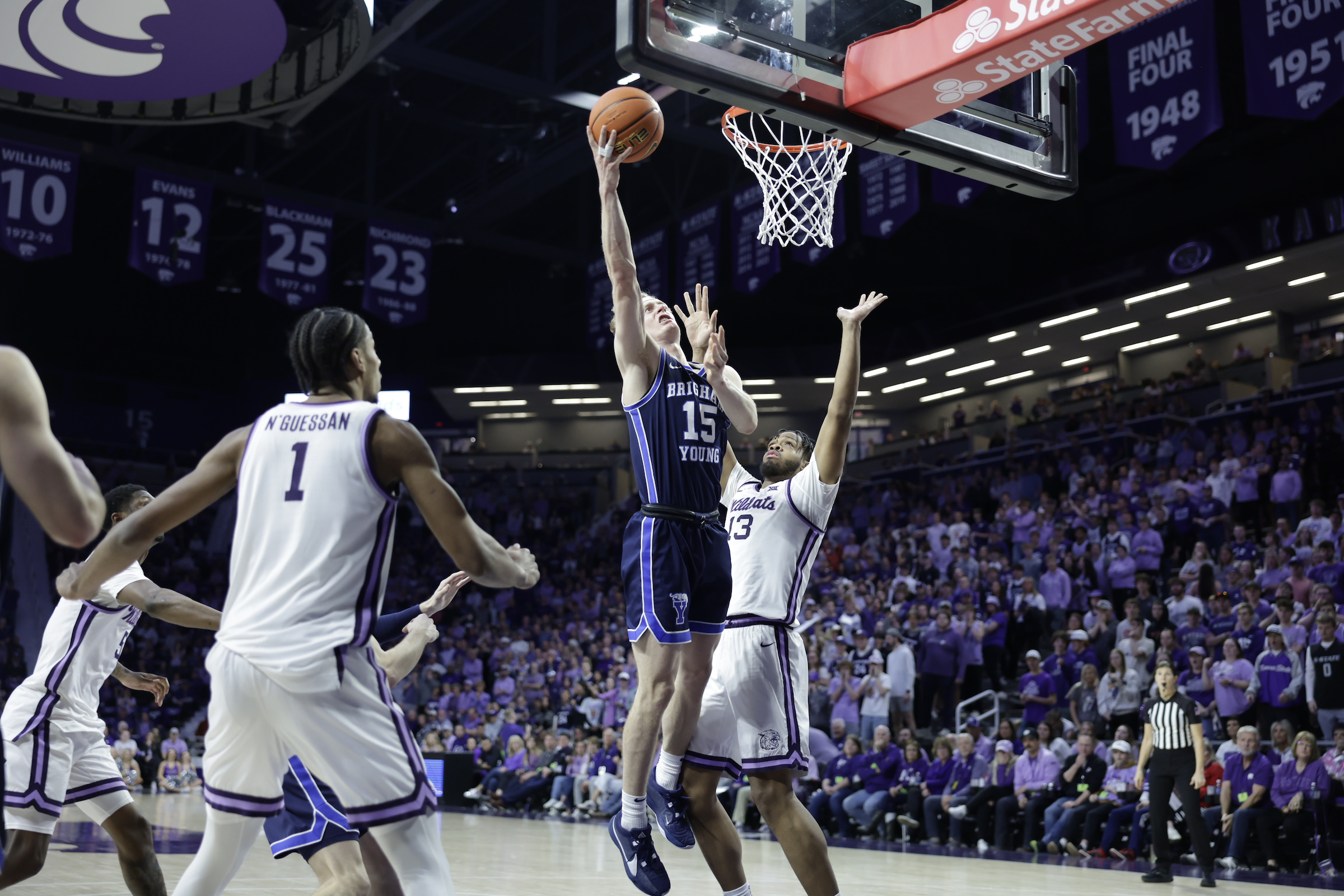 BYU guard Richie Saunders drives to the rim in the second half of a Big 12 men's basketball game against Kansas State, Saturday, Feb. 24, 2024 at Bramlage Coliseum in Manhattan, Kansas.
