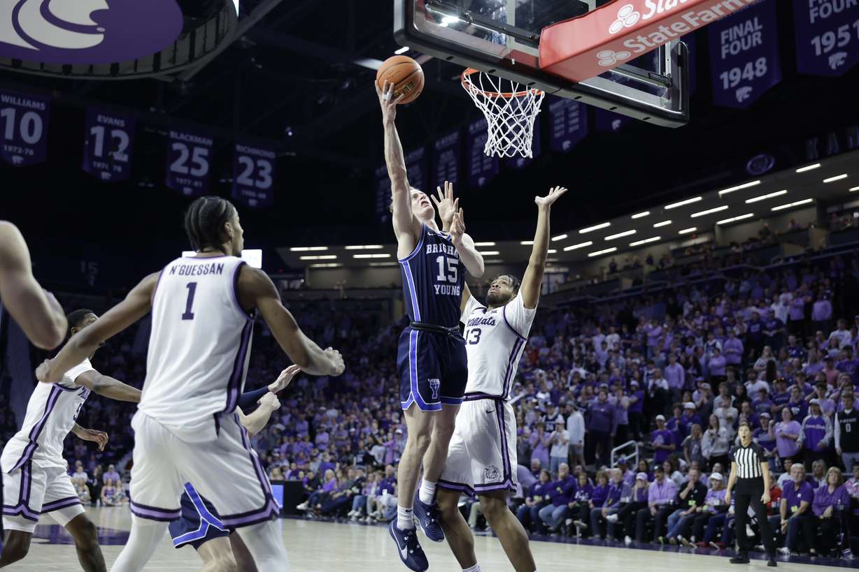 BYU guard Richie Saunders drives to the rim in the second half of a Big 12 men's basketball game against Kansas State, Saturday, Feb. 24, 2024 at Bramlage Coliseum in Manhattan, Kansas.