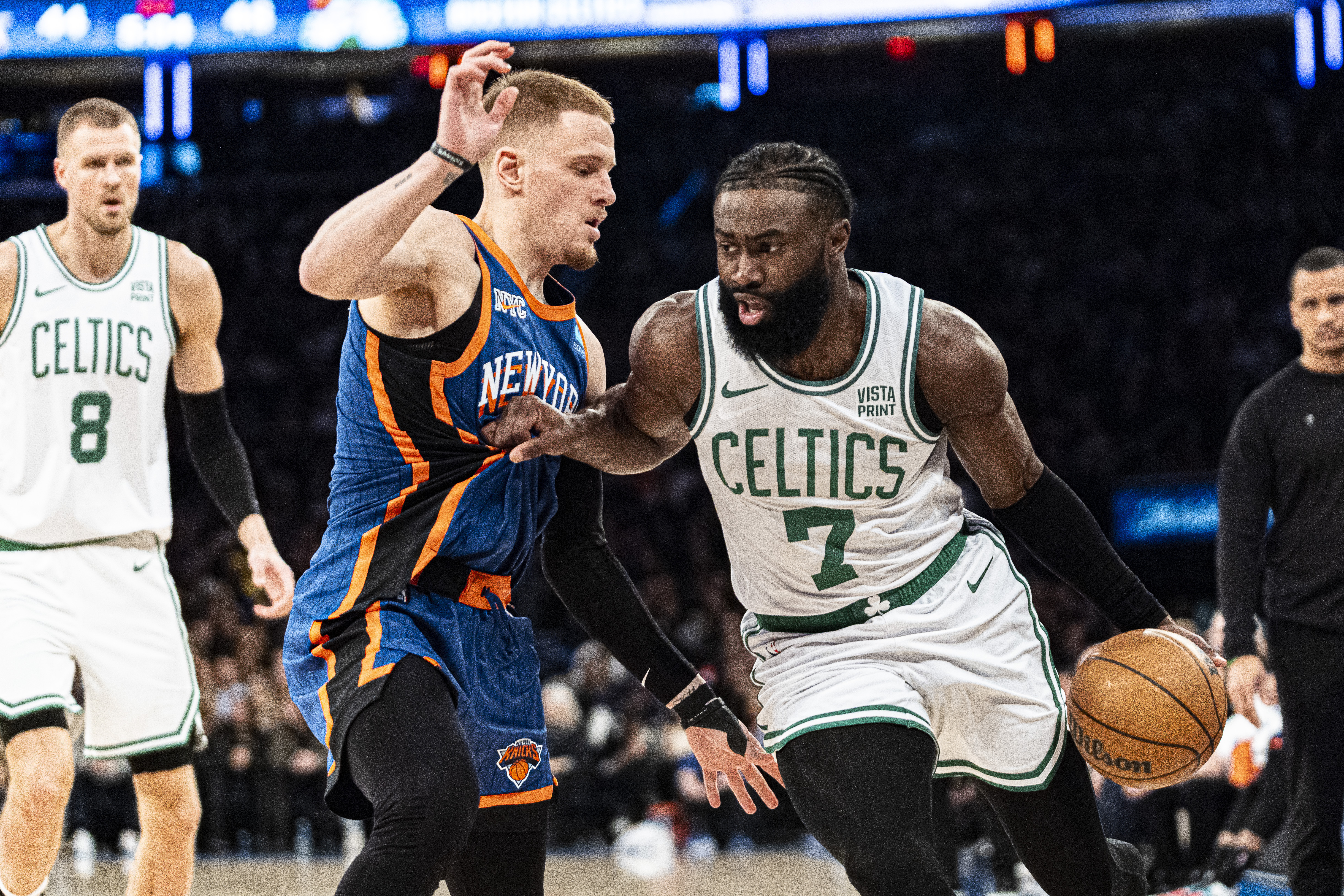 Boston Celtics guard Jaylen Brown (7) drives to the basket against New York Knicks guard Donte DiVincenzo, center left, during the first half of an NBA basketball game in New York, Saturday, Feb. 24, 2024.