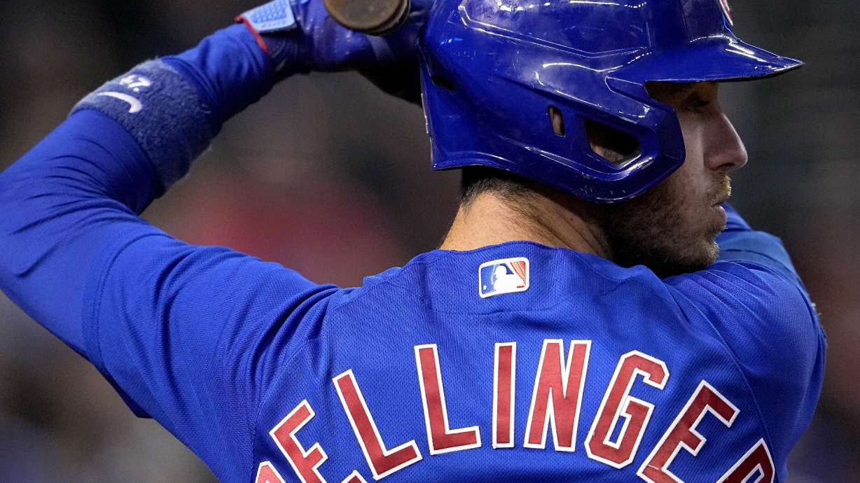 FILE - Chicago Cubs' Cody Bellinger waits to hit against the Arizona Diamondbacks during the first inning of a baseball game, Sept. 15, 2023, in Phoenix. Bellinger is going back to the Cubs, agreeing to an $80 million, three-year contract. The slugger can opt out of the deal after each of the first two seasons, according to a person familiar with the agreement who spoke to the AP on Sunday, Feb. 25, 2024 on condition of anonymity because it was pending a physical.