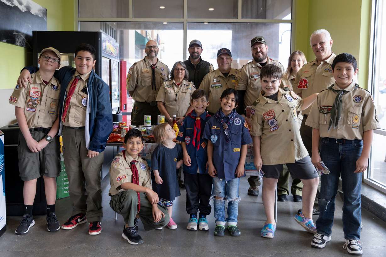 Val Parrish volunteers with Troop 1996 during a food drive at Smith’s Grocery in West Valley City on Feb. 10.