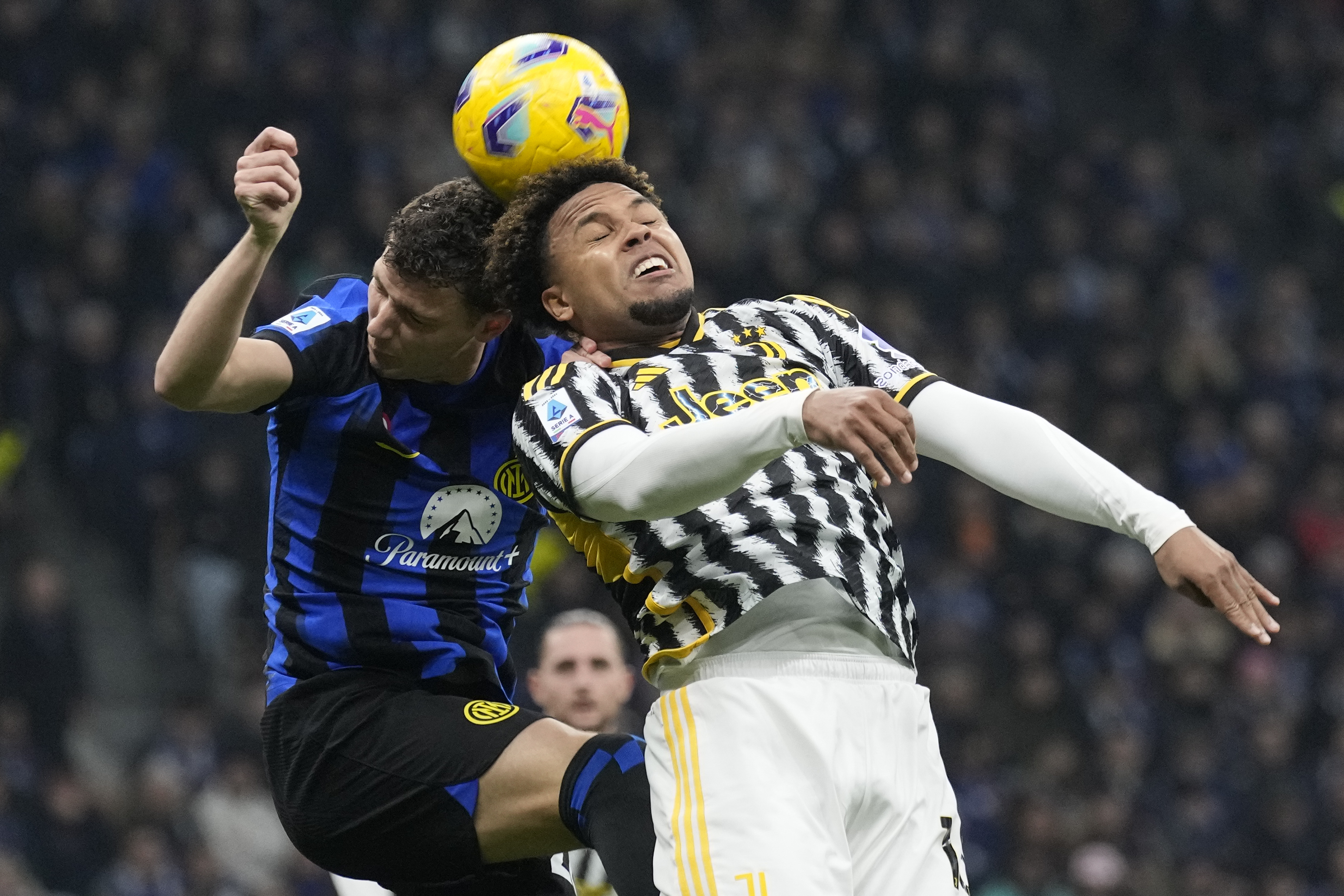 Inter Milan's Benjamin Pavard, left, and Juventus' Weston McKennie jump for the ball during a Serie A soccer match between Inter Milan and Juventus, in Milan, Italy, Sunday, Feb. 4, 2024.