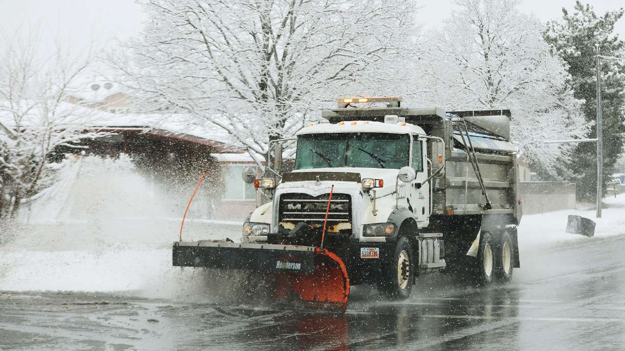 A snowplow clears the road in Cottonwood Heights on Feb. 9. An incoming storm is expected to provide heavy mountain snow and possibly some valley snow accumulation.