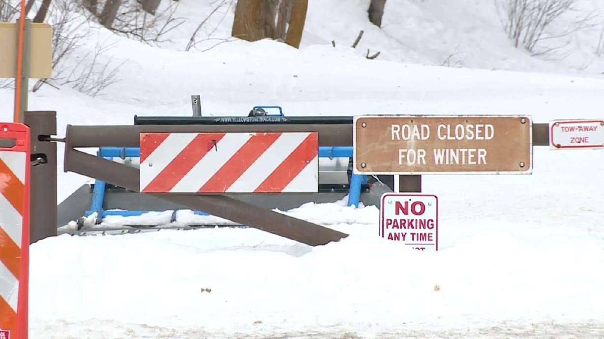 A gate marks where a roadway is closed for the winter in Big Cottonwood Canyon. A woman was rescued from the canyon Monday after police say she was seriously injured in an avalanche near Little Water Peak.