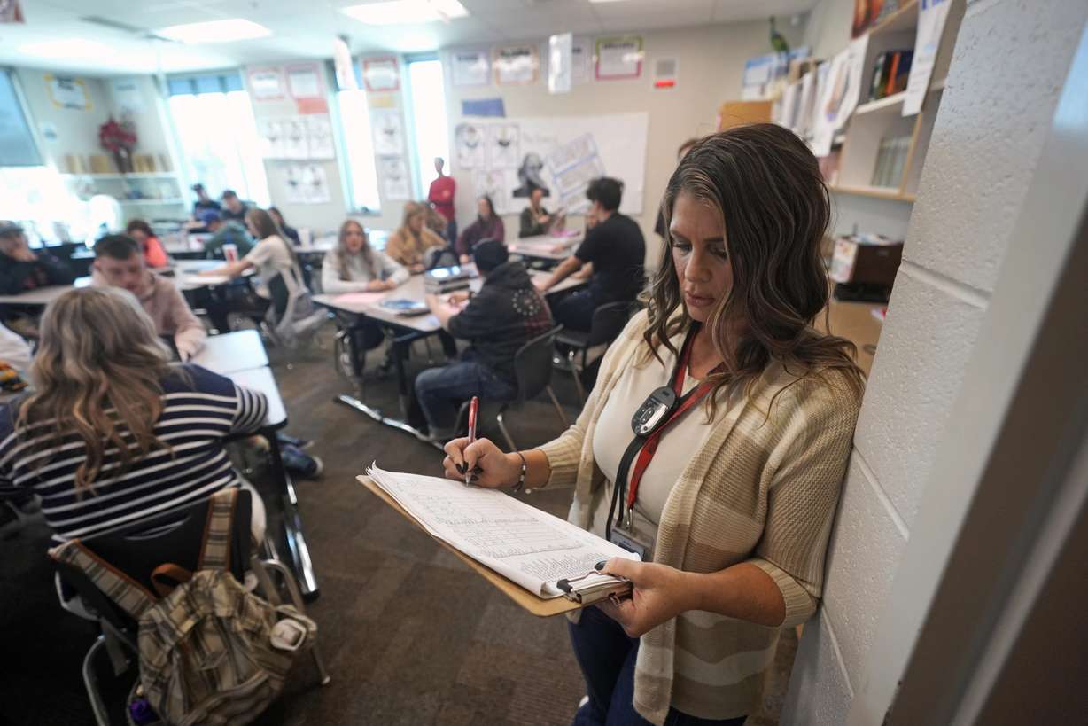 Kelli Anderson takes attendance from the rear of her Language Arts 9 class at Delta High School, Friday, in Delta.