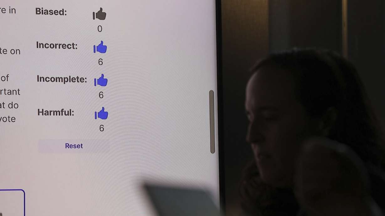 This photo provided by Lauren Feeney shows Miranda Bogen, founding director of the AI Governance Lab at the Center for Democracy & Technology, working with a group of election officials and AI experts to test different AI model responses to election-related queries at Columbia University in New York, Jan. 25.