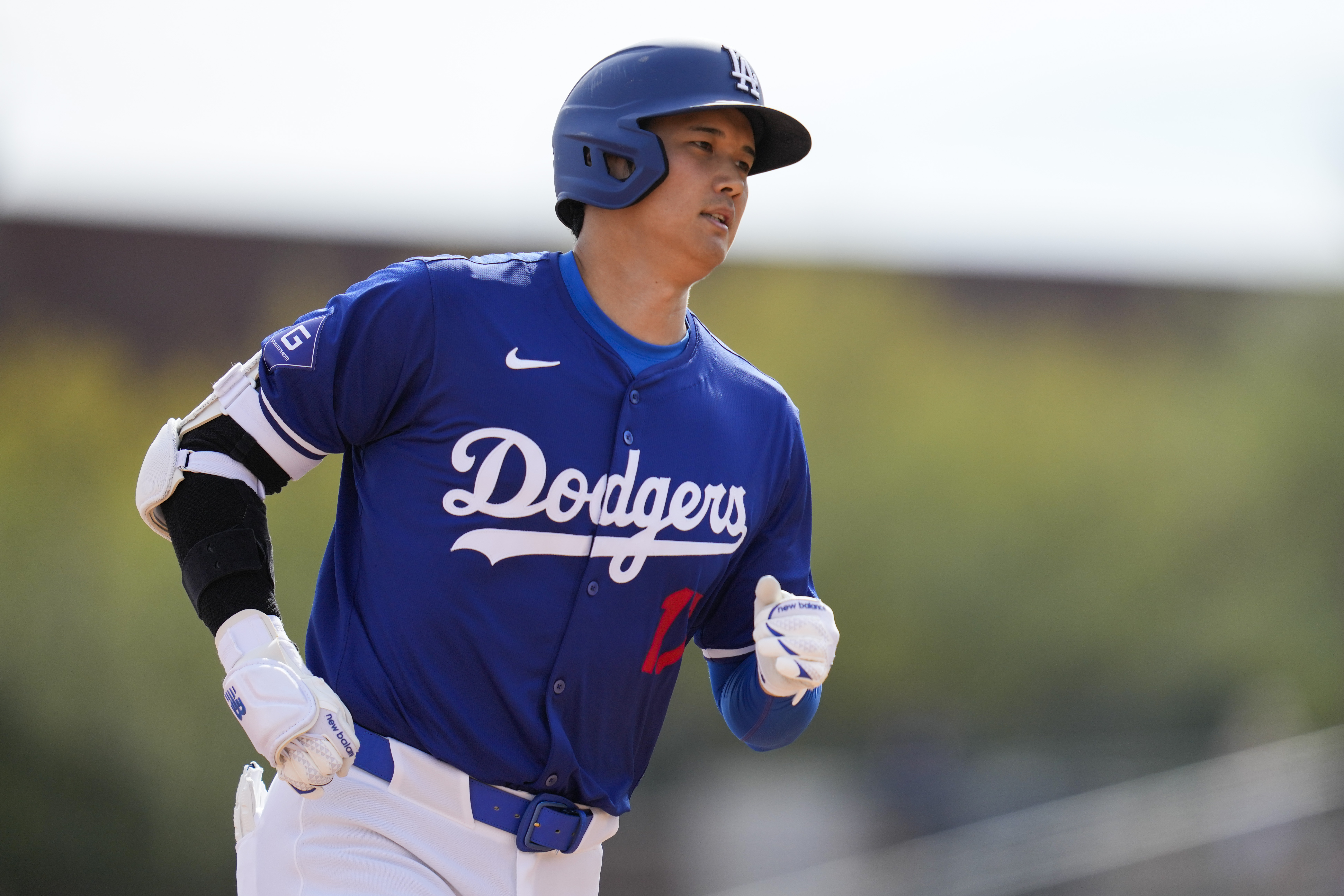 Los Angeles Dodgers designated hitter Shohei Ohtani runs the bases after hitting a home run during the fifth inning of a spring training baseball game against the Chicago White Sox in Phoenix, Tuesday, Feb. 27, 2024. Jose Ramos also scored.