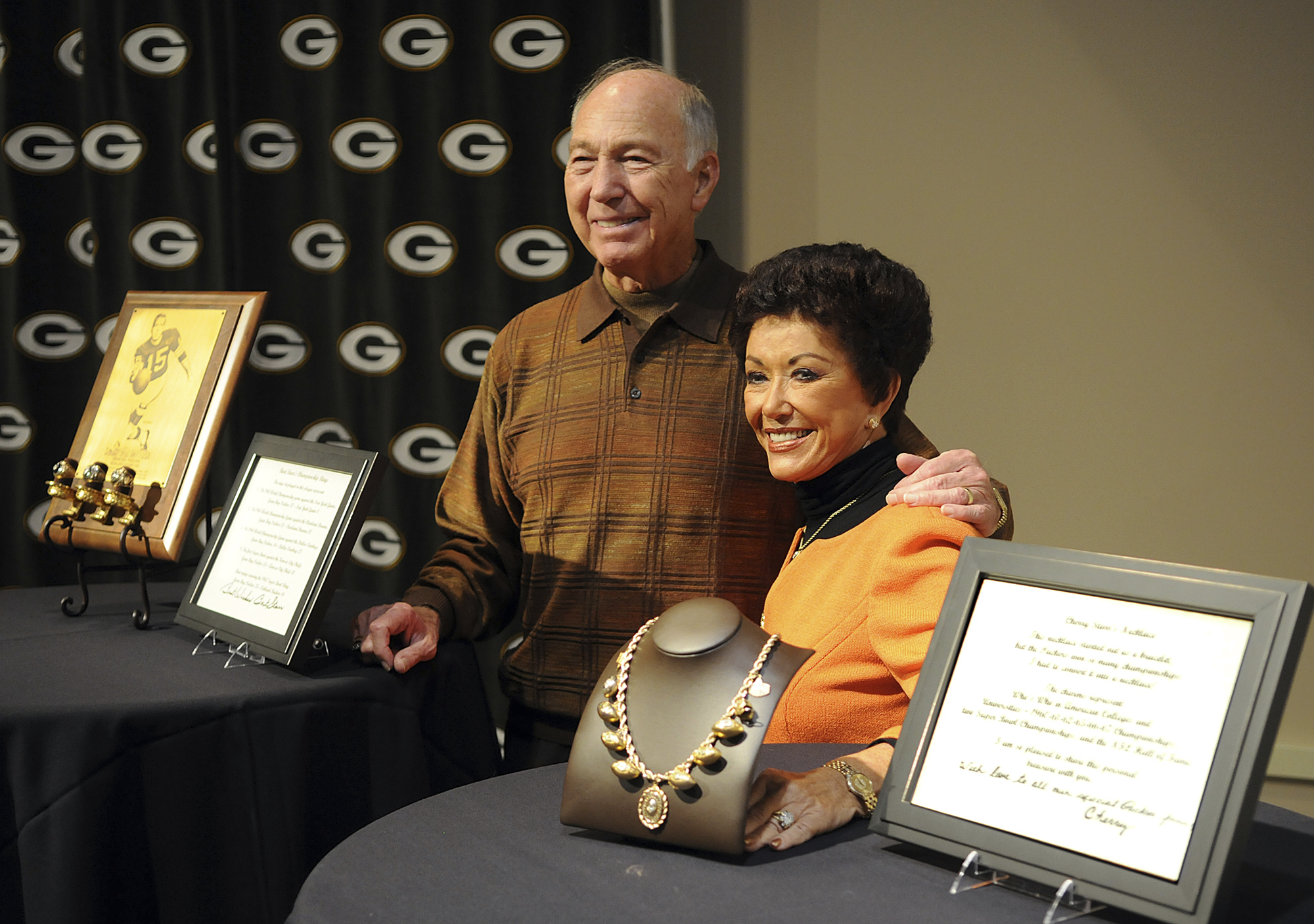 FILE - Former Green Bay Packers quarterback Bart Starr, left, and his wife Cherry Starr appear at the Packers Hall of Fame in Green Bay, Wis., Sept. 18, 2010, to announce their donation of three of Bart's World Championship rings, Cherry's necklace and other items. Philanthropist Cherry Starr has died Tuesday, Feb. 27, 2024, according to Rawhide Youth Services, an organization that helps at-risk youth that the couple worked closely with.