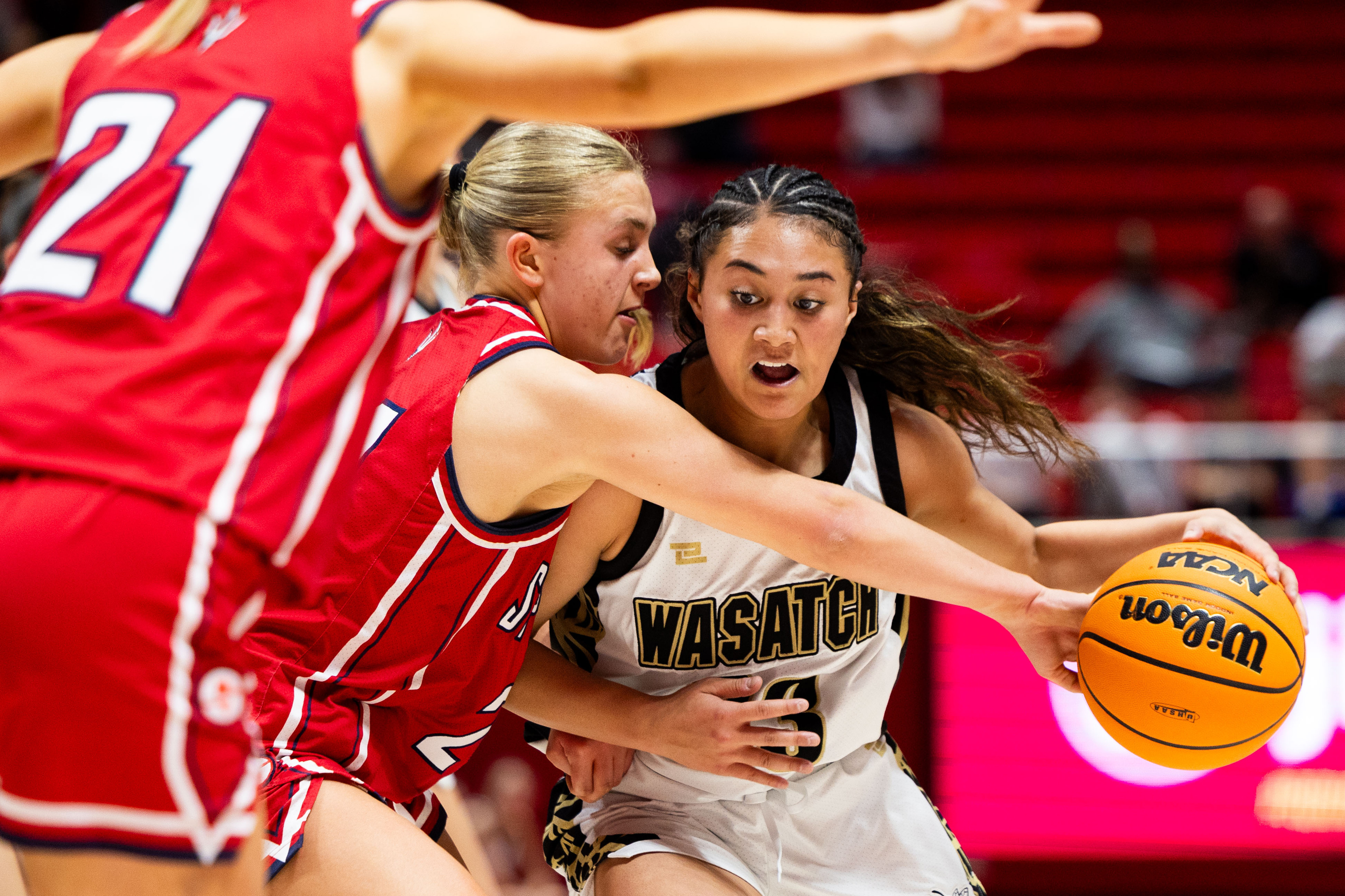 Wasatch’s Fili Liava’a drives the ball past Springville’s Sammy Hullinger in the semifinals for 5A high school girls basketball at the Jon M. Huntsman Center in Salt Lake City on Tuesday, Feb. 27, 2024.