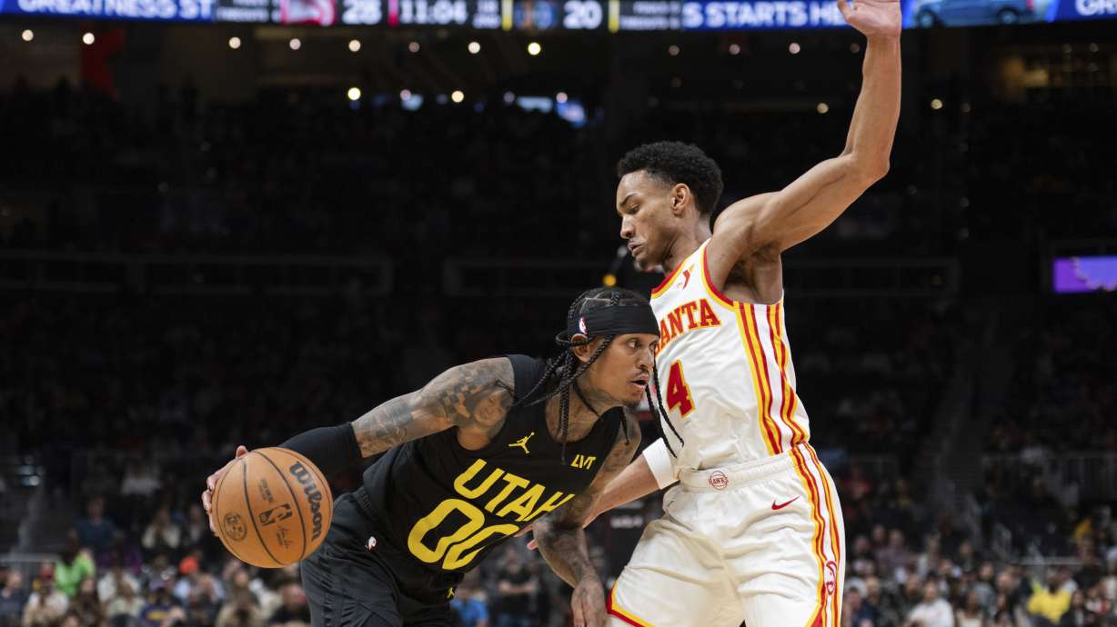Utah Jazz guard Jordan Clarkson (00) drives to the basket against Atlanta Hawks guard Kobe Bufkin (4) during the first half of an NBA basketball game Tuesday, Feb. 27, 2024, in Atlanta.