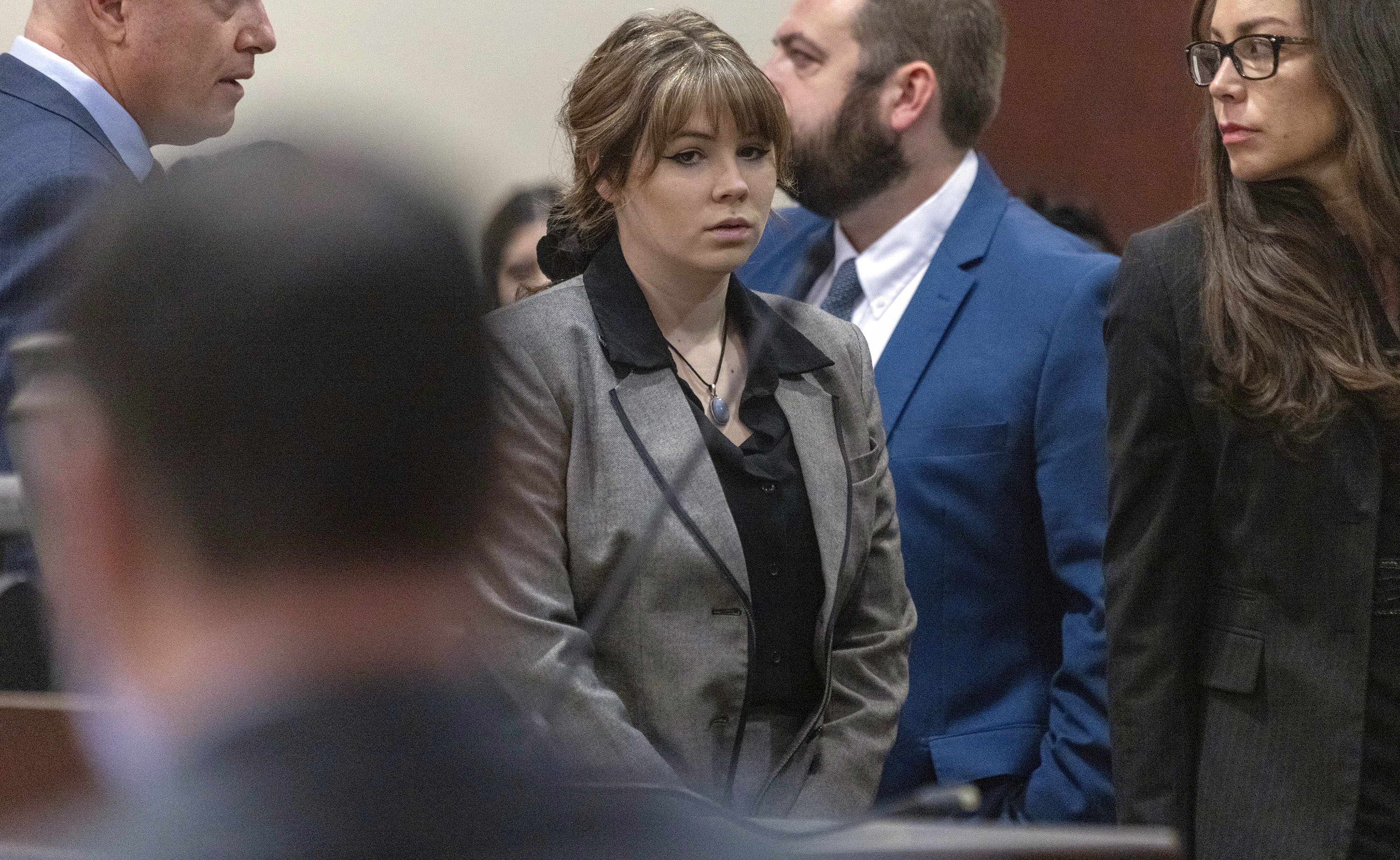 Defendant Hannah Gutierrez-Reed, former armorer on the set of the movie "Rust," walks back to her seat after speaking with District Judge Mary Marlowe Sommer before her trial at District Court, Monday, in Santa Fe, N.M.
