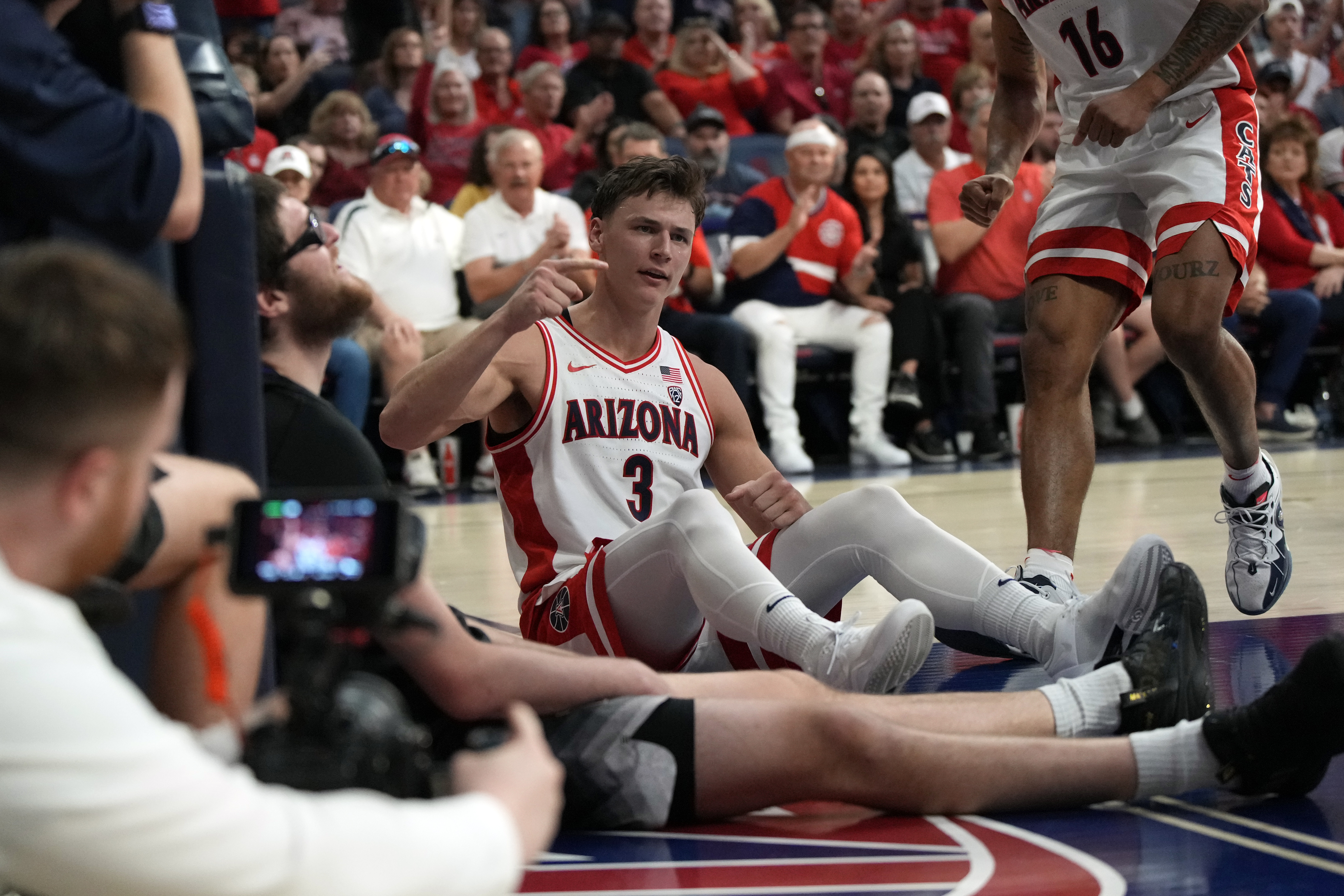 Arizona guard Pelle Larsson (3) reacts after getting fouled during the second half of an NCAA college basketball game against Washington, Saturday, Feb. 24, 2024, in Tucson, Ariz. 