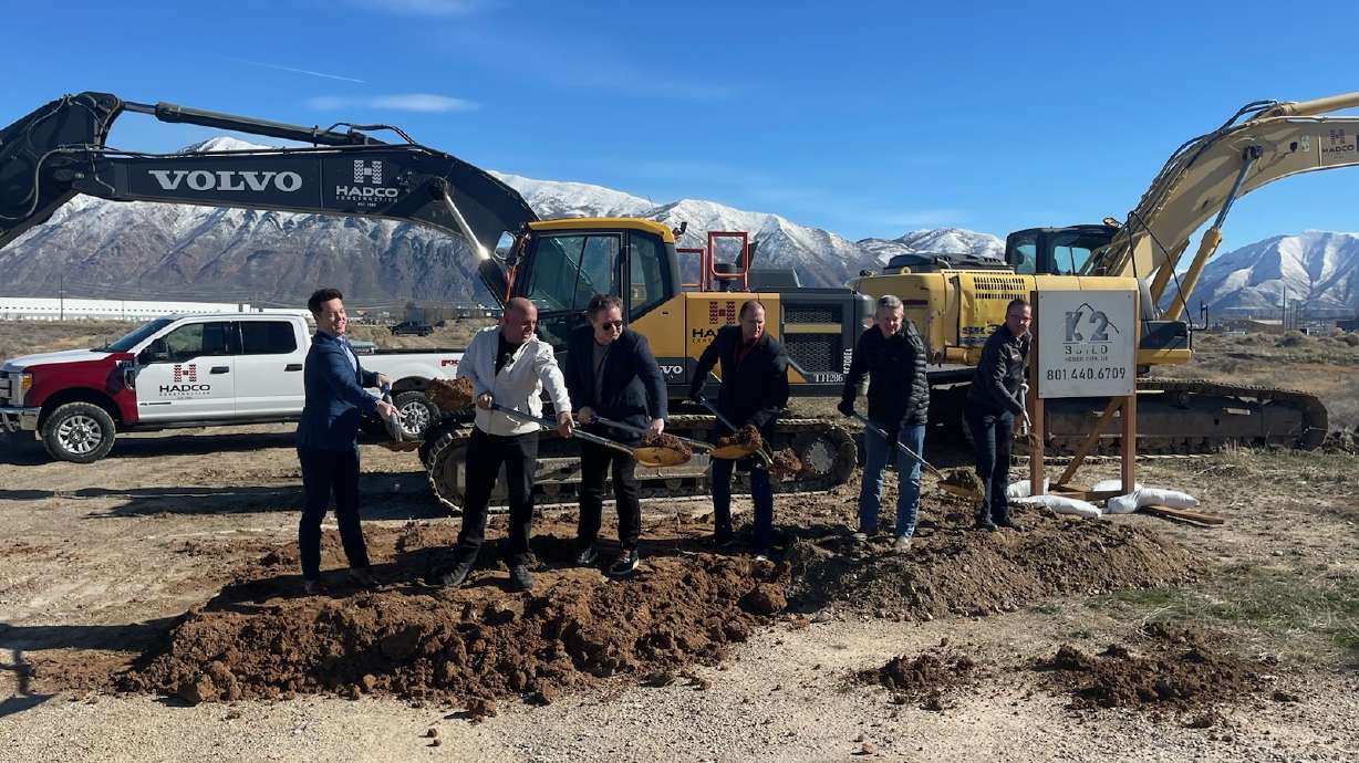 Mike Patey, second from left, breaks ground on the Patey Aviation Business Park with other partners on Wednesday. Patey Aviation and Spanish Fork say the project's aim is to bring the general community and aviation community together.
