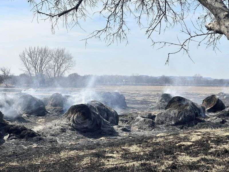 Smoldering remains are seen Wednesday after a wildfire passed near Canadian, Texas.