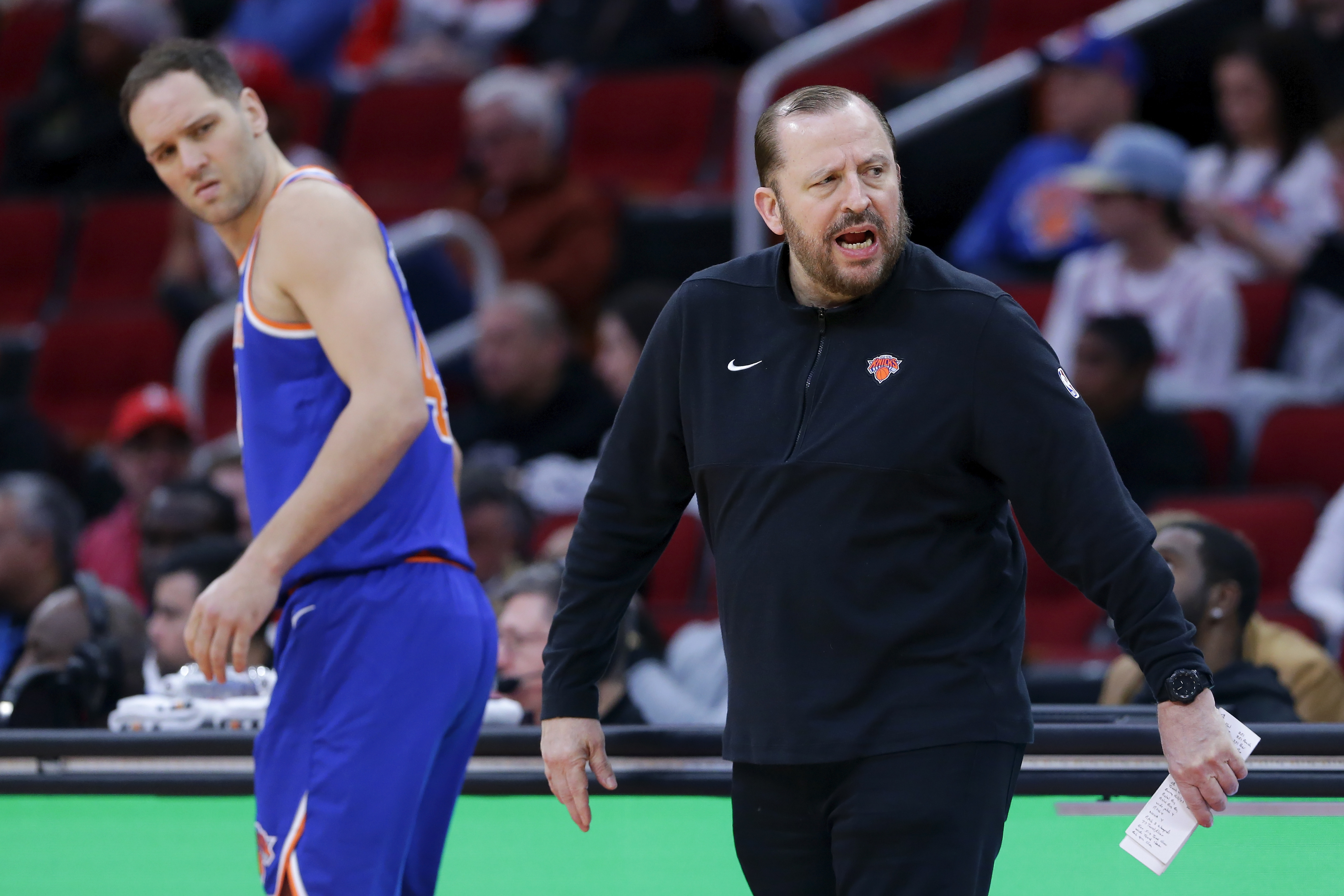 New York Knicks forward Bojan Bogdanovic, left, looks back as head coach Tom Thibodeau, right, protests a foul call during the first half of an NBA basketball game against the Houston Rockets, Monday, Feb. 12, 2024, in Houston.