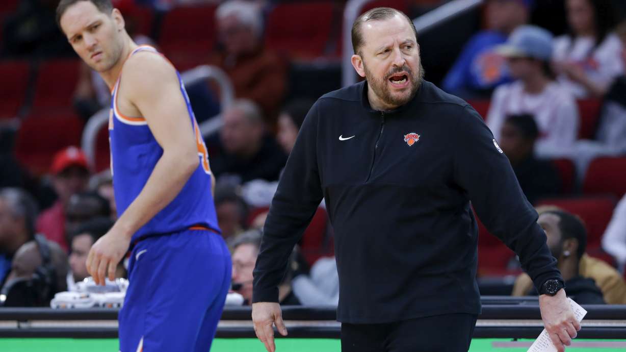 New York Knicks forward Bojan Bogdanovic, left, looks back as head coach Tom Thibodeau, right, protests a foul call during the first half of an NBA basketball game against the Houston Rockets, Monday, Feb. 12, 2024, in Houston.
