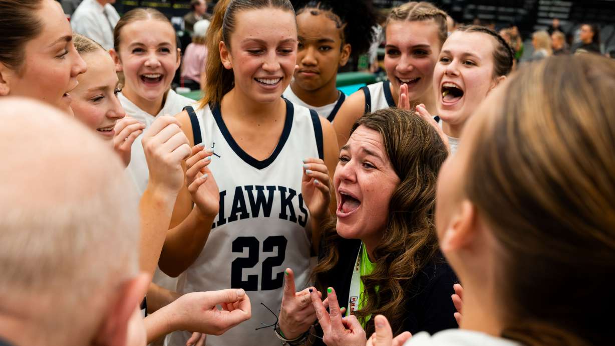 Ridgeline celebrates their 58-34 victory over Snow Canyon for the 4A girls state basketball championship at the UCCU Center in Orem on Wednesday, Feb. 28, 2024.