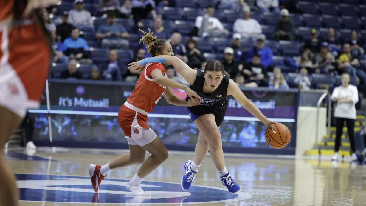 BYU guard Kailey Woolston drives against Houston during a Big 12 women's basketball game, Wednesday, Feb. 28, 2024 at the Marriott Center in Provo, Utah.