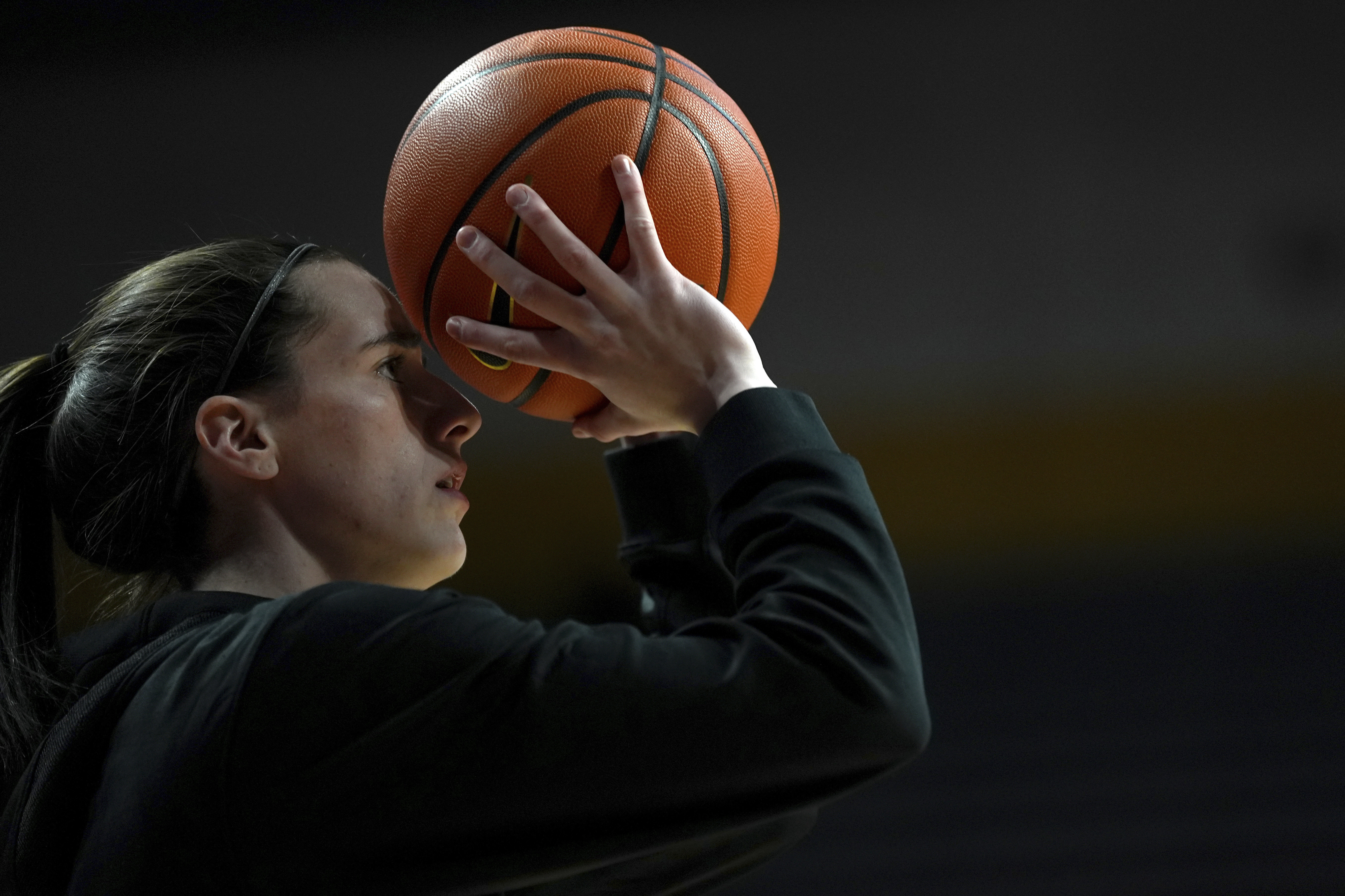 Iowa guard Caitlin Clark warms up before an NCAA college basketball game against Minnesota, Wednesday, Feb. 28, 2024, in Minneapolis. 