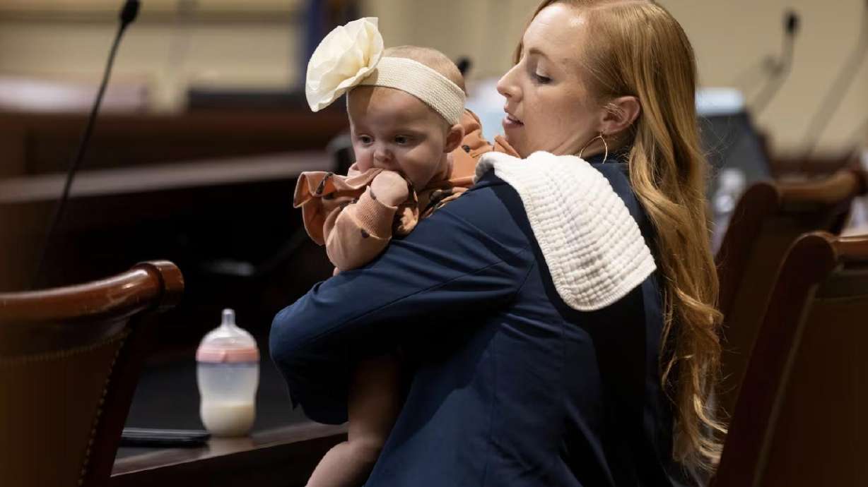 Rep. Candice Pierucci, R-Herriman, sits with her daughter Quincy after presenting SB230 at the Capitol in Salt Lake City on Monday. Serving as a legislator with young children provides valuable perspective, lawmakers say.