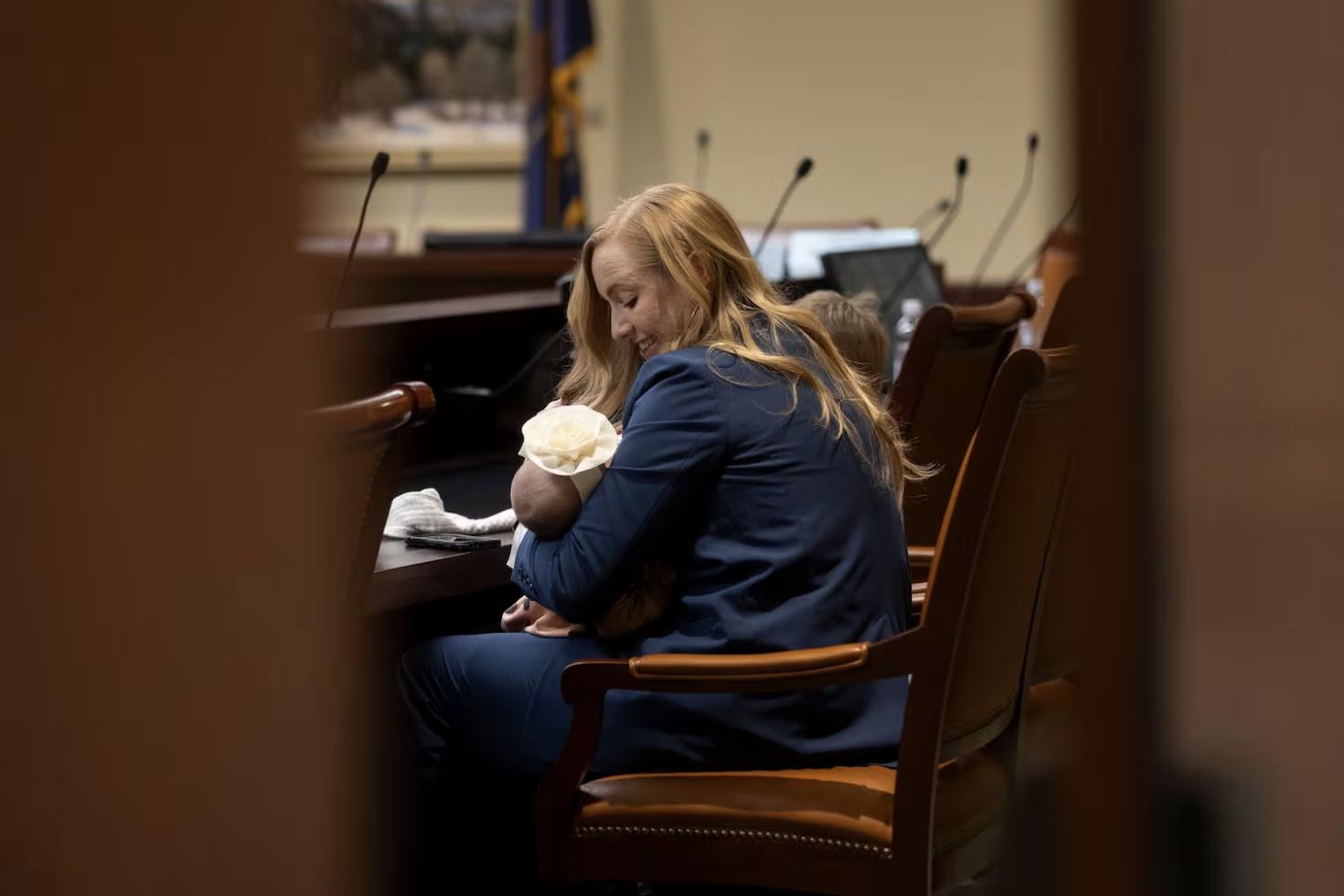 Rep. Candice Pierucci, R-Herriman, sits with her daughter Quincy after presenting SB230 at the Capitol in Salt Lake City on Monday.